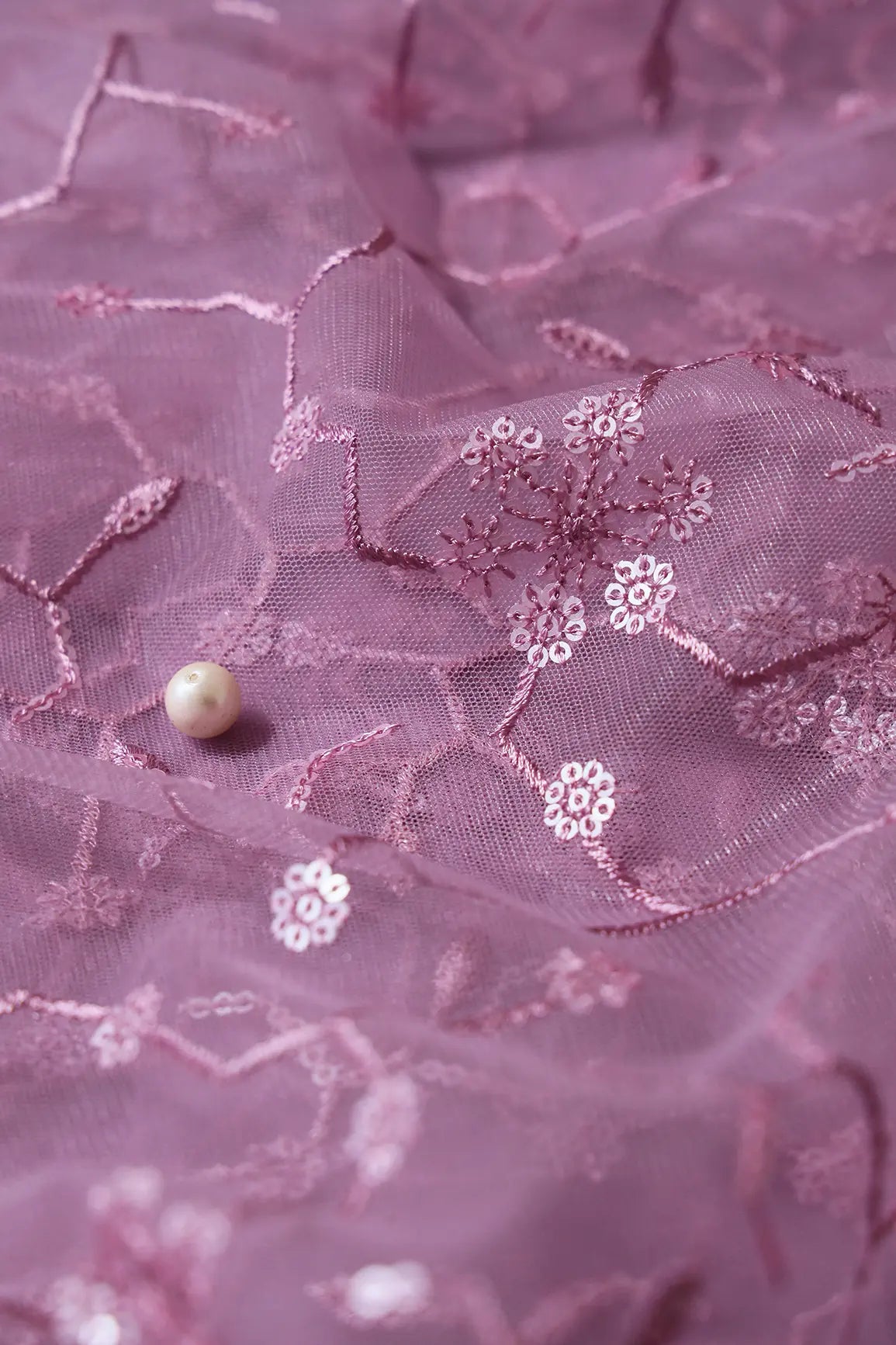 Beautiful Water Sequins Small Floral Embroidery On Mauve Soft Net Fabric