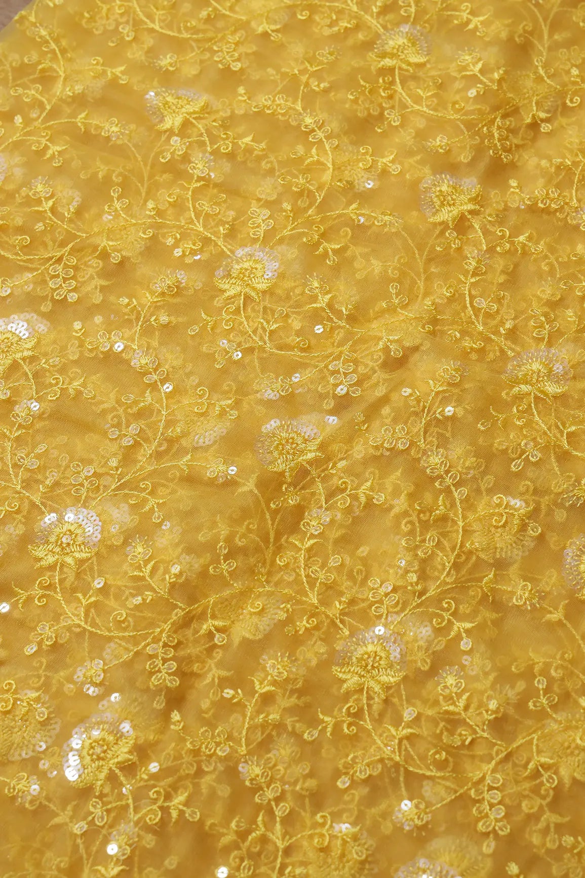 Yellow Thread With Water Sequins Floral Embroidery On Yellow Soft Net Fabric