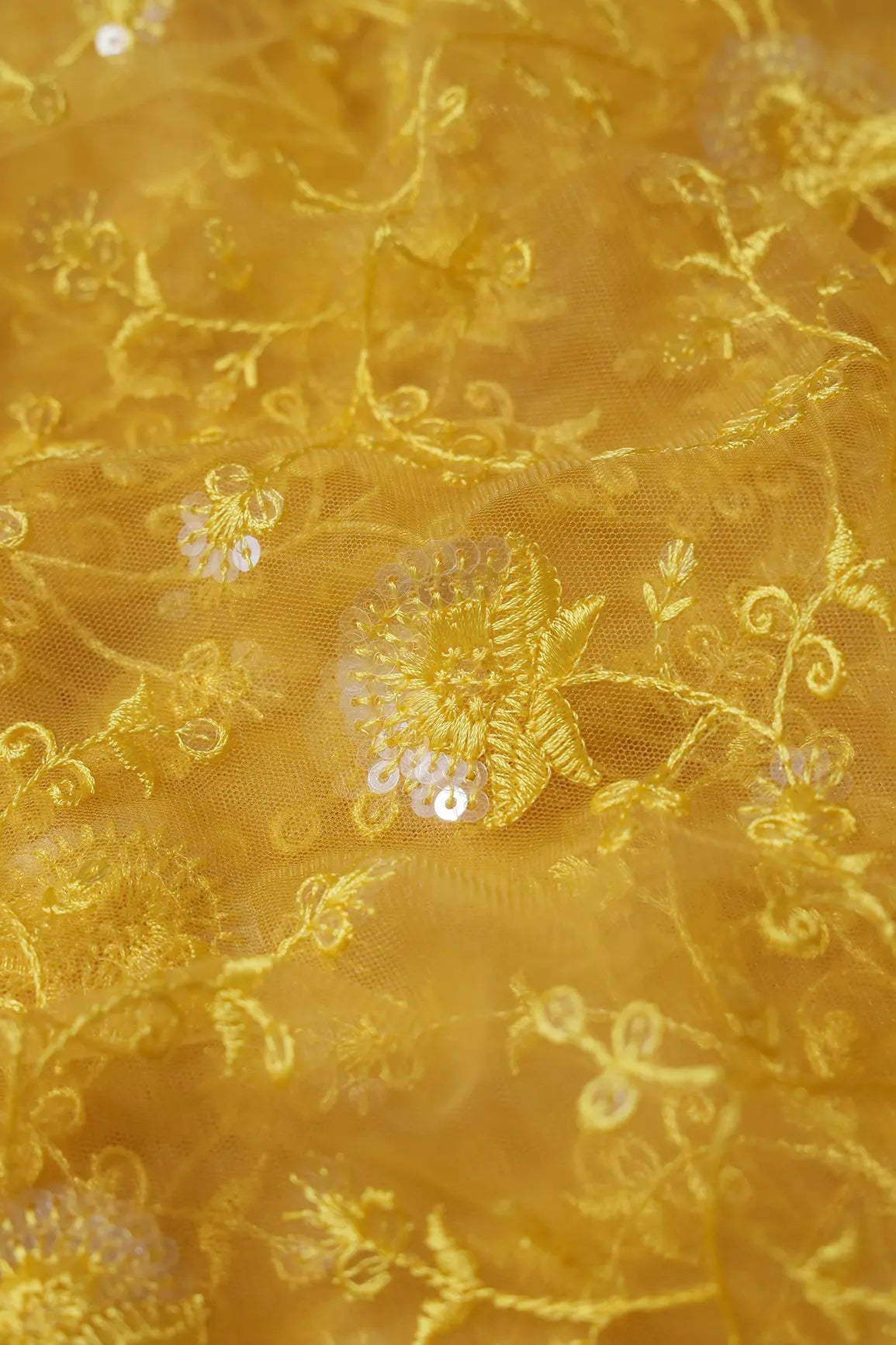 Yellow Thread With Water Sequins Floral Embroidery On Yellow Soft Net Fabric
