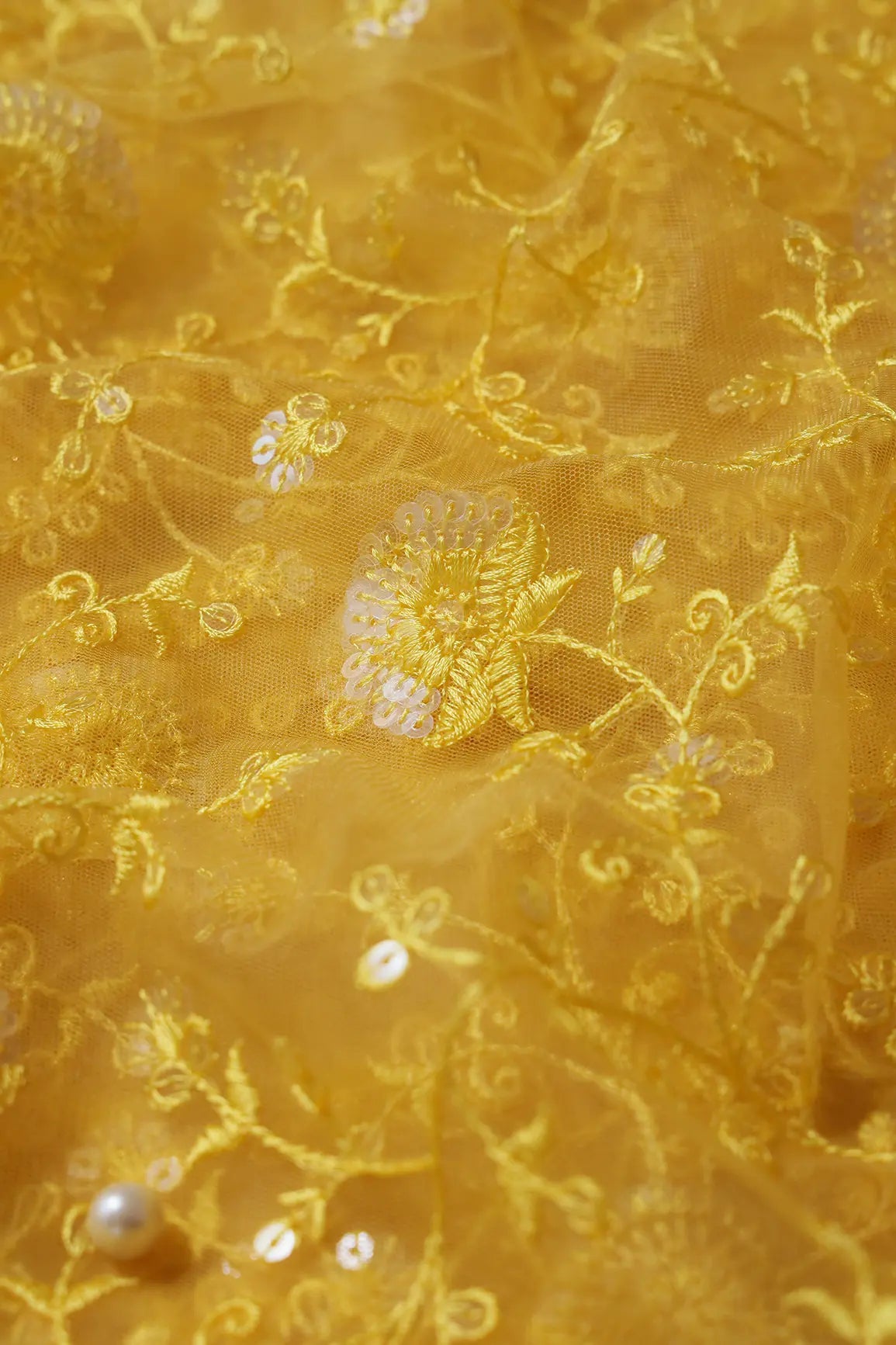 Yellow Thread With Water Sequins Floral Embroidery On Yellow Soft Net Fabric