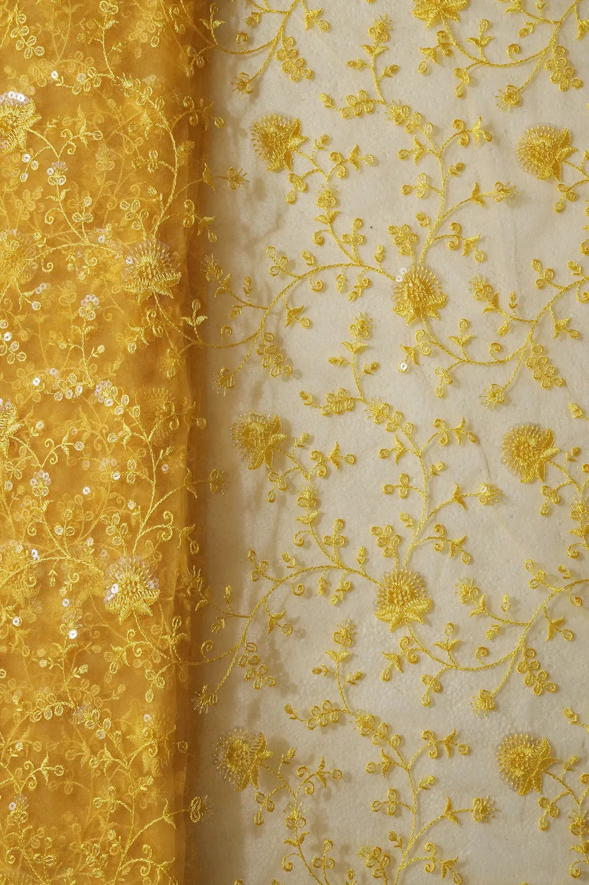 Yellow Thread With Water Sequins Floral Embroidery On Yellow Soft Net Fabric