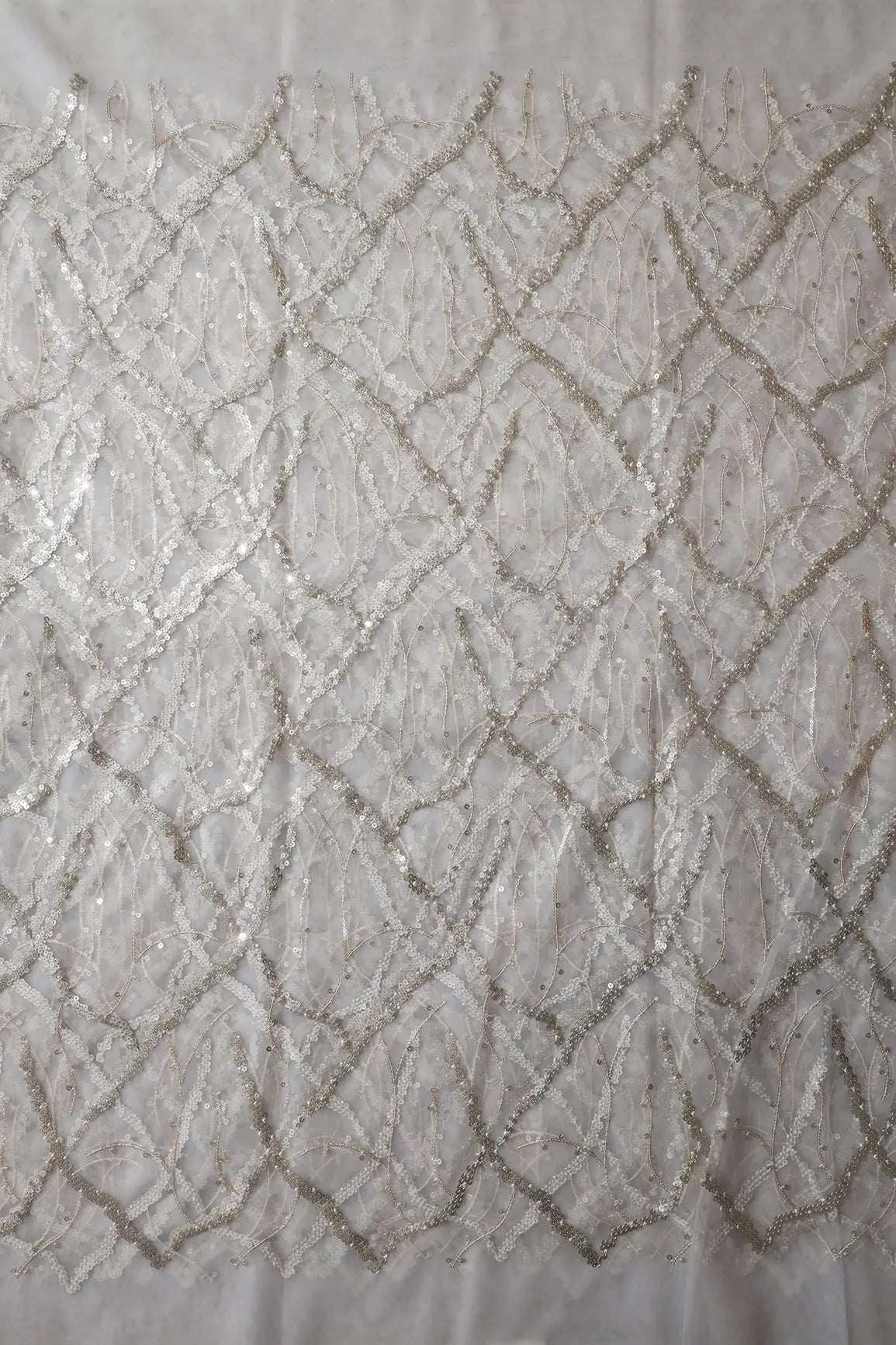 Silver Sequins Geometric Embroidery On White Dyeable Soft Net Fabric