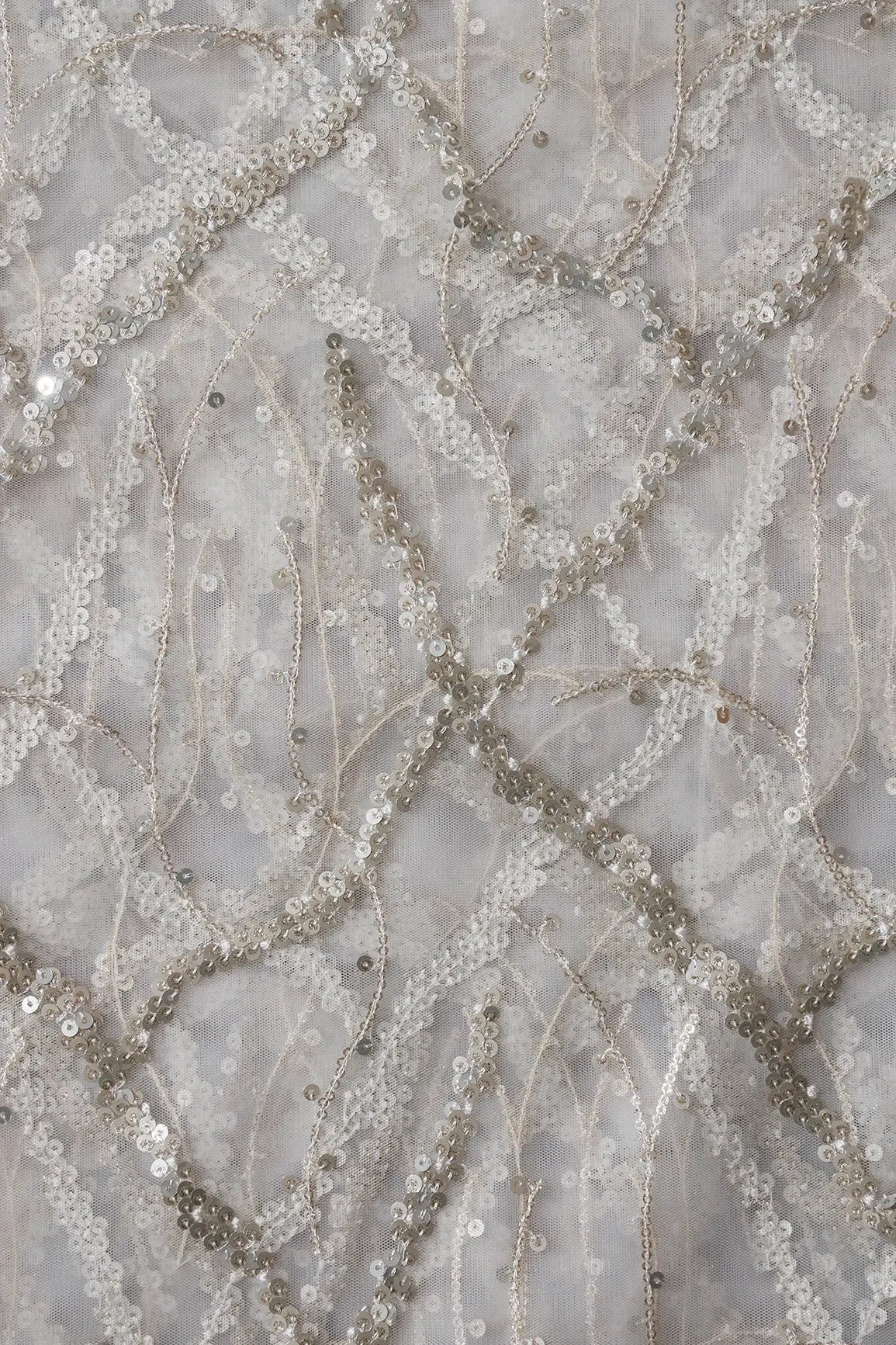 Silver Sequins Geometric Embroidery On White Dyeable Soft Net Fabric