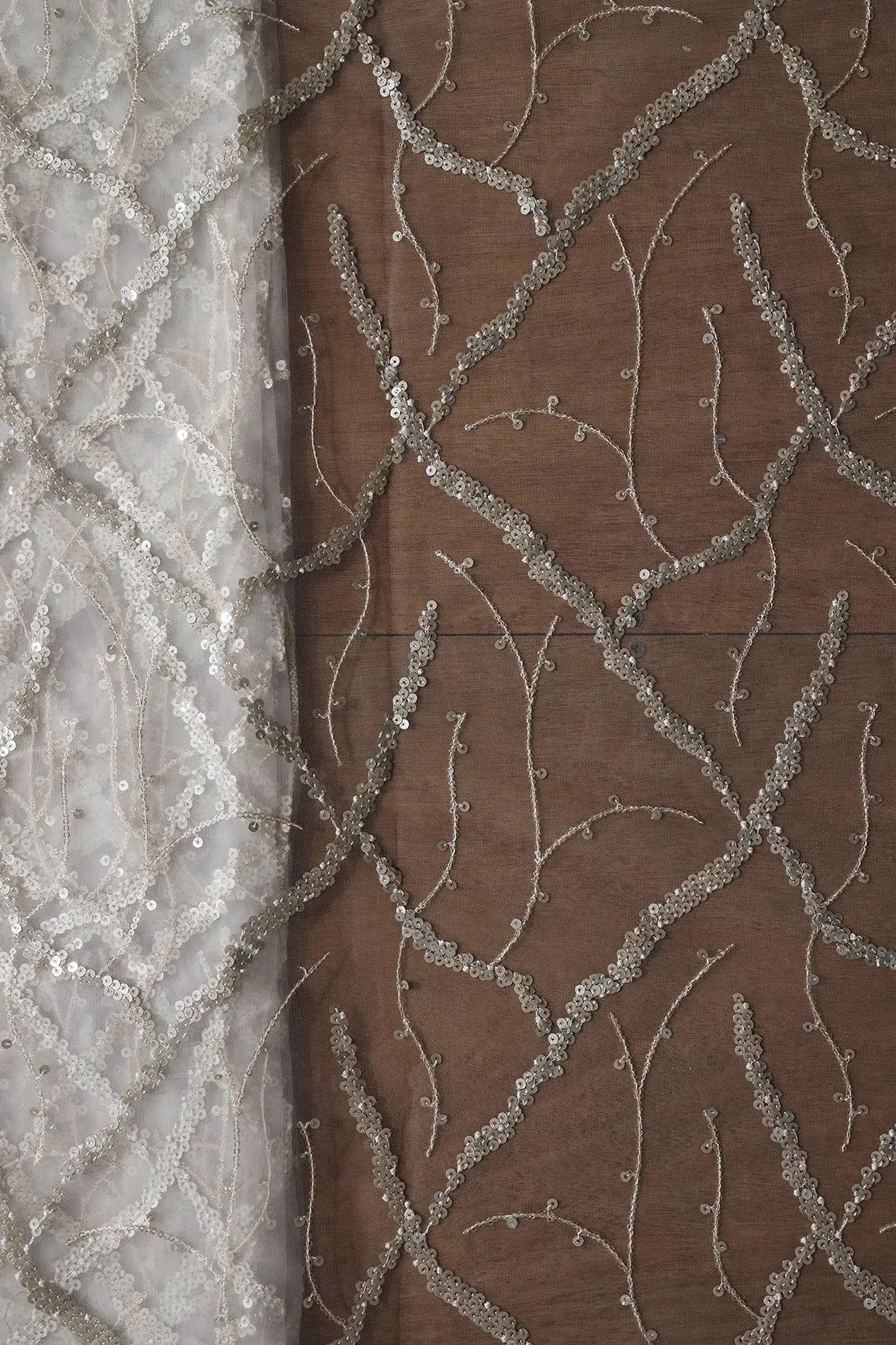 Silver Sequins Geometric Embroidery On White Dyeable Soft Net Fabric