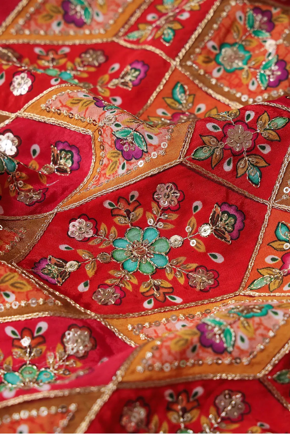 Red And Orange Traditional Positional Print With Gold Zari And Sequins Embroidery On Crepe Fabric