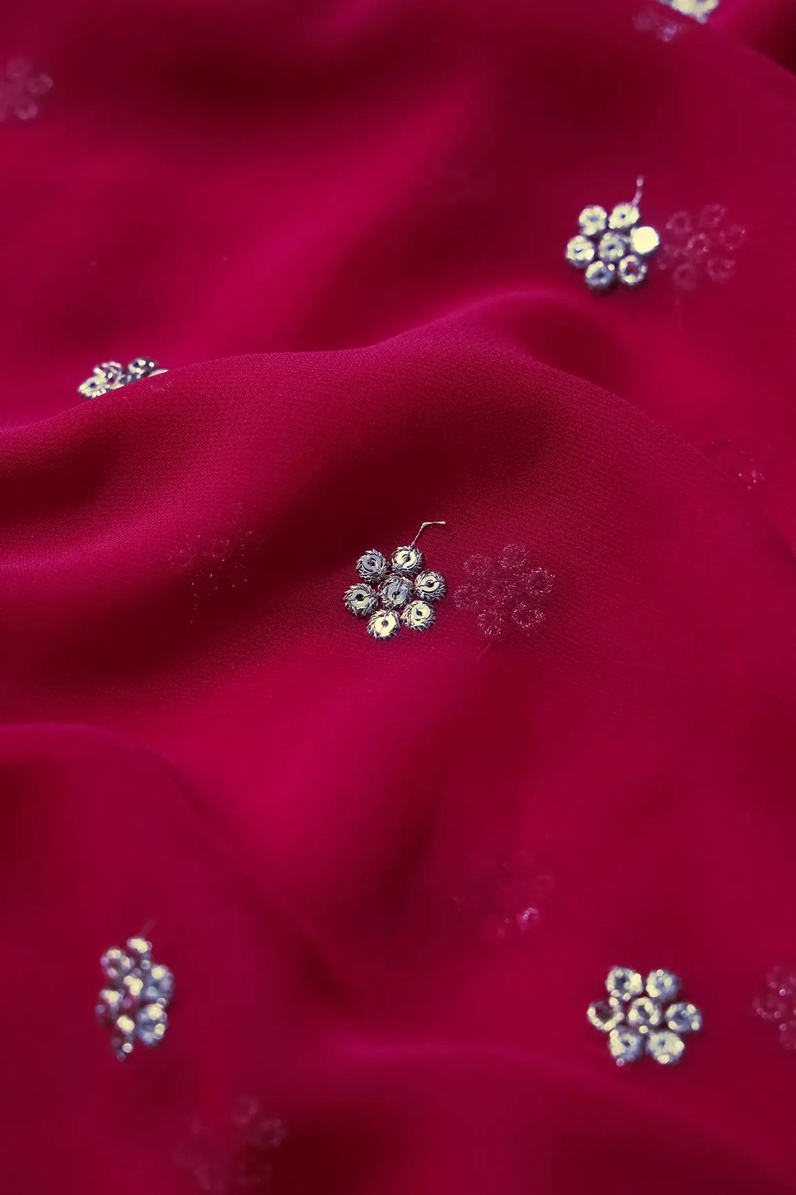 Gold Sequins With Gold Zari Small Motif Embroidery Work On Fuchsia Georgette Fabric