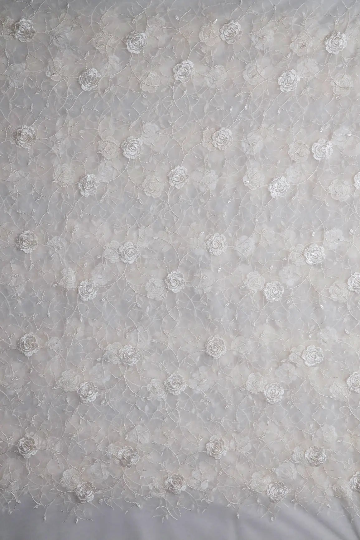 Water Sequins With White Thread Floral Embroidery On White Dyeable Soft Net Fabric