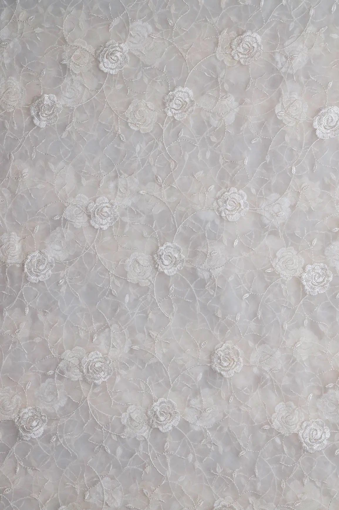 Water Sequins With White Thread Floral Embroidery On White Dyeable Soft Net Fabric
