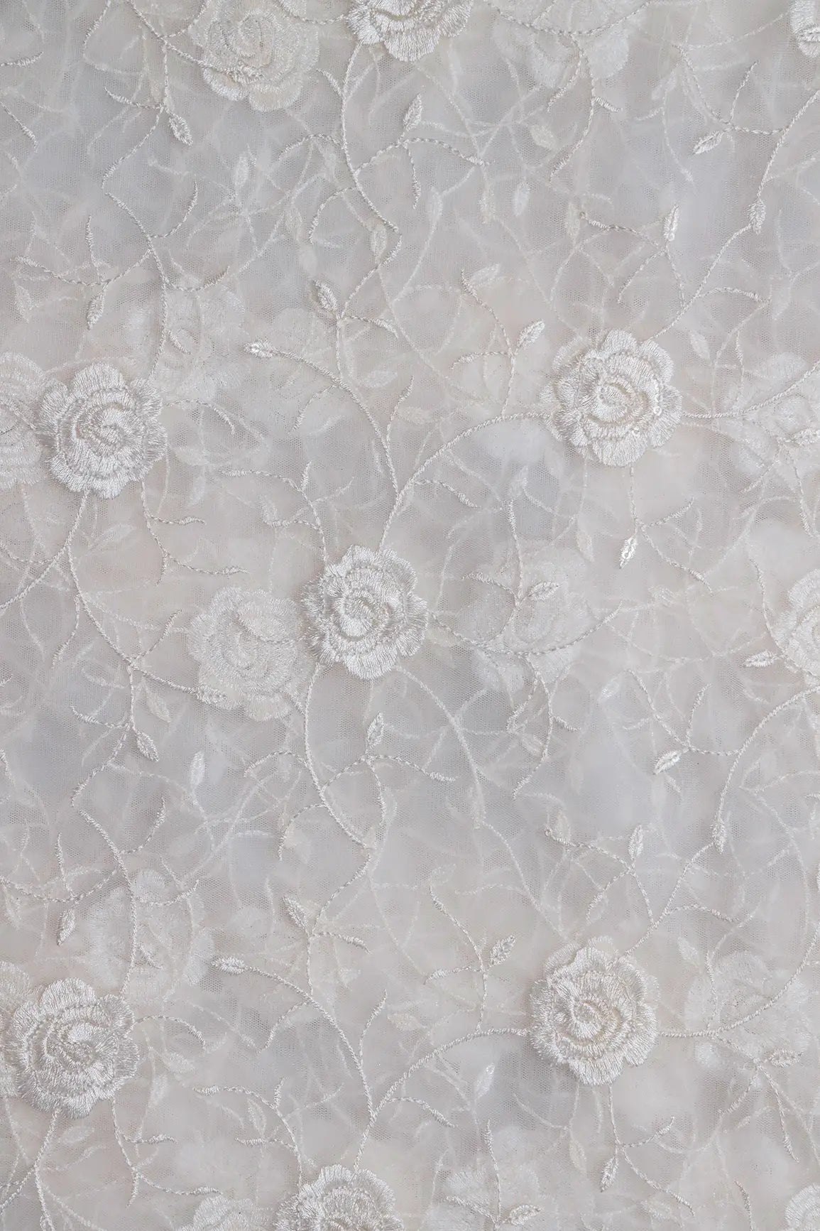 Water Sequins With White Thread Floral Embroidery On White Dyeable Soft Net Fabric
