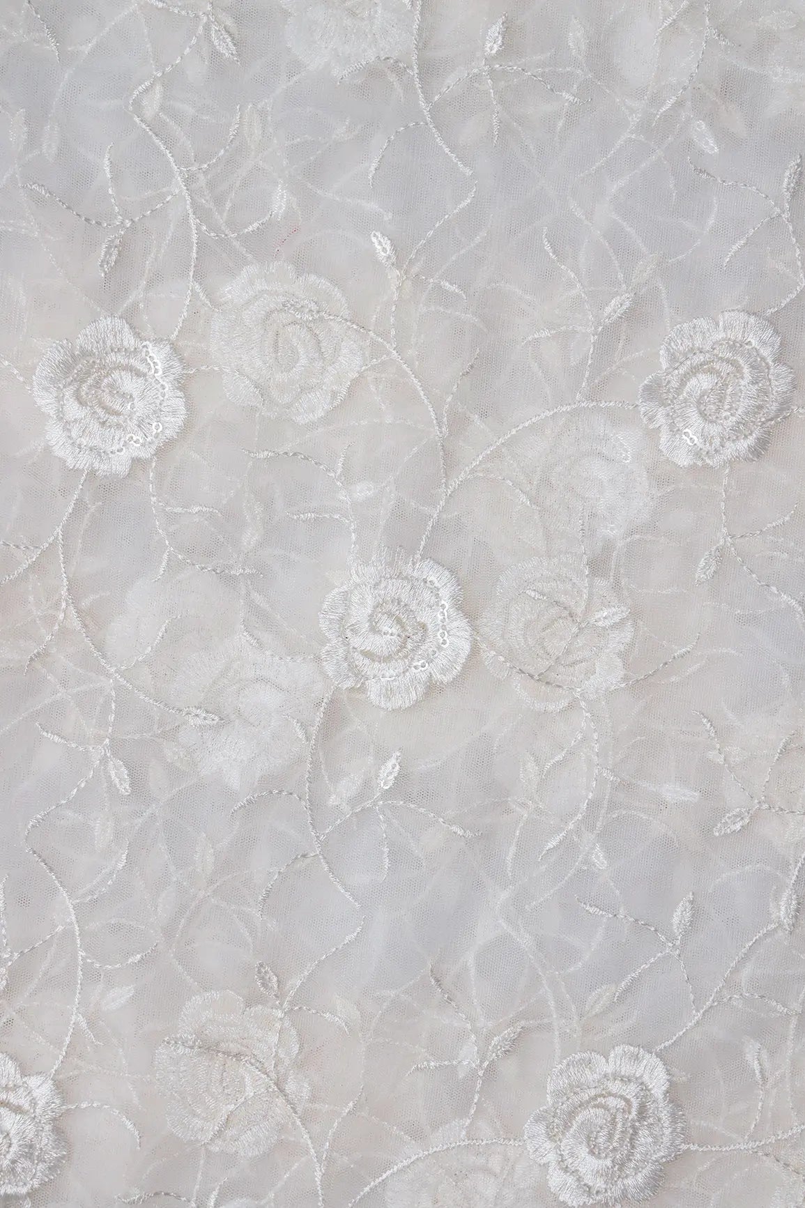 Water Sequins With White Thread Floral Embroidery On White Dyeable Soft Net Fabric