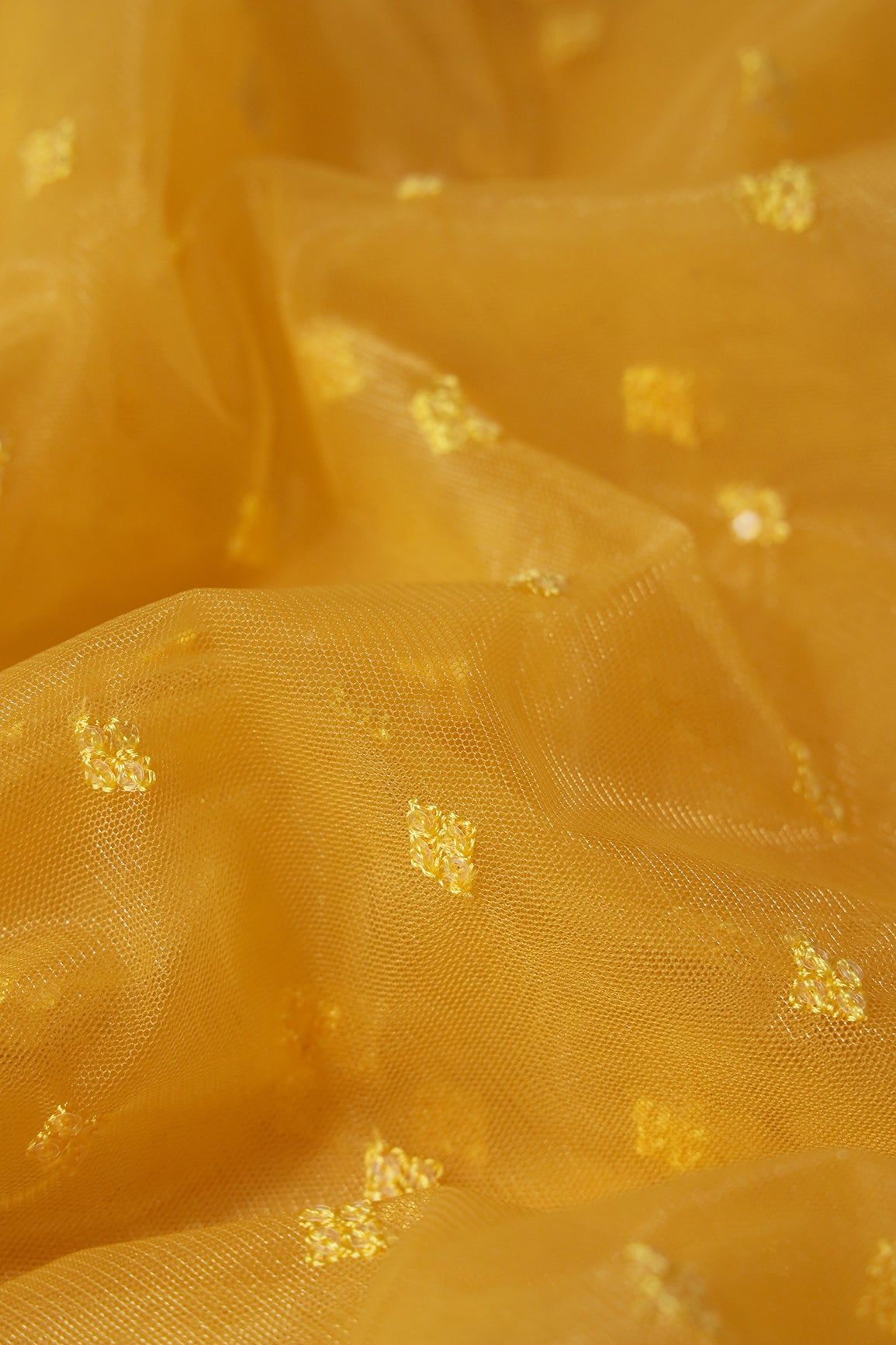 Small Motif Sequins Embroidery Work On Yellow Soft Net Fabric