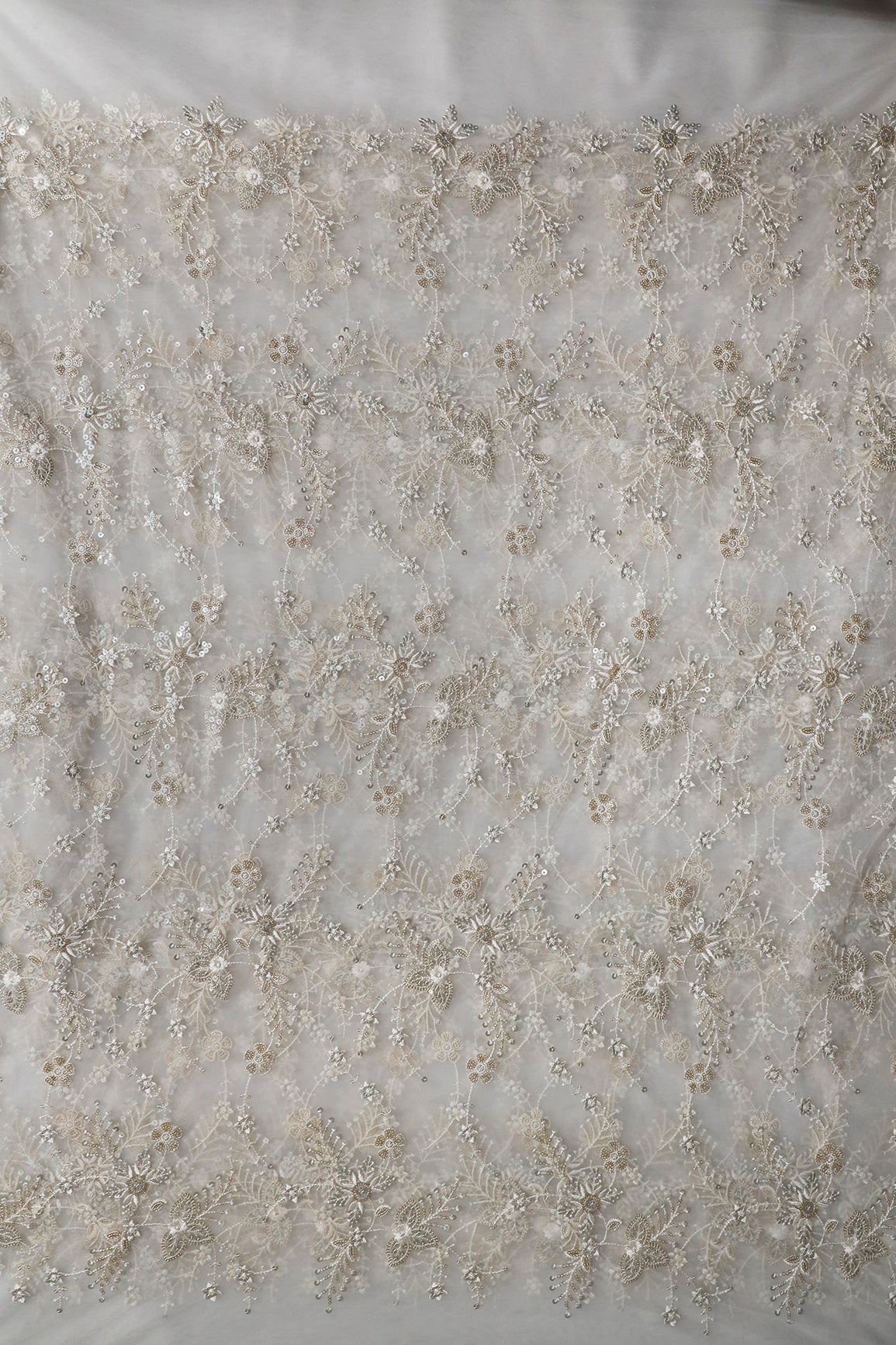 Beautiful White Thread With Sequins Floral Embroidery Work On White Dyeable Soft Net Fabric