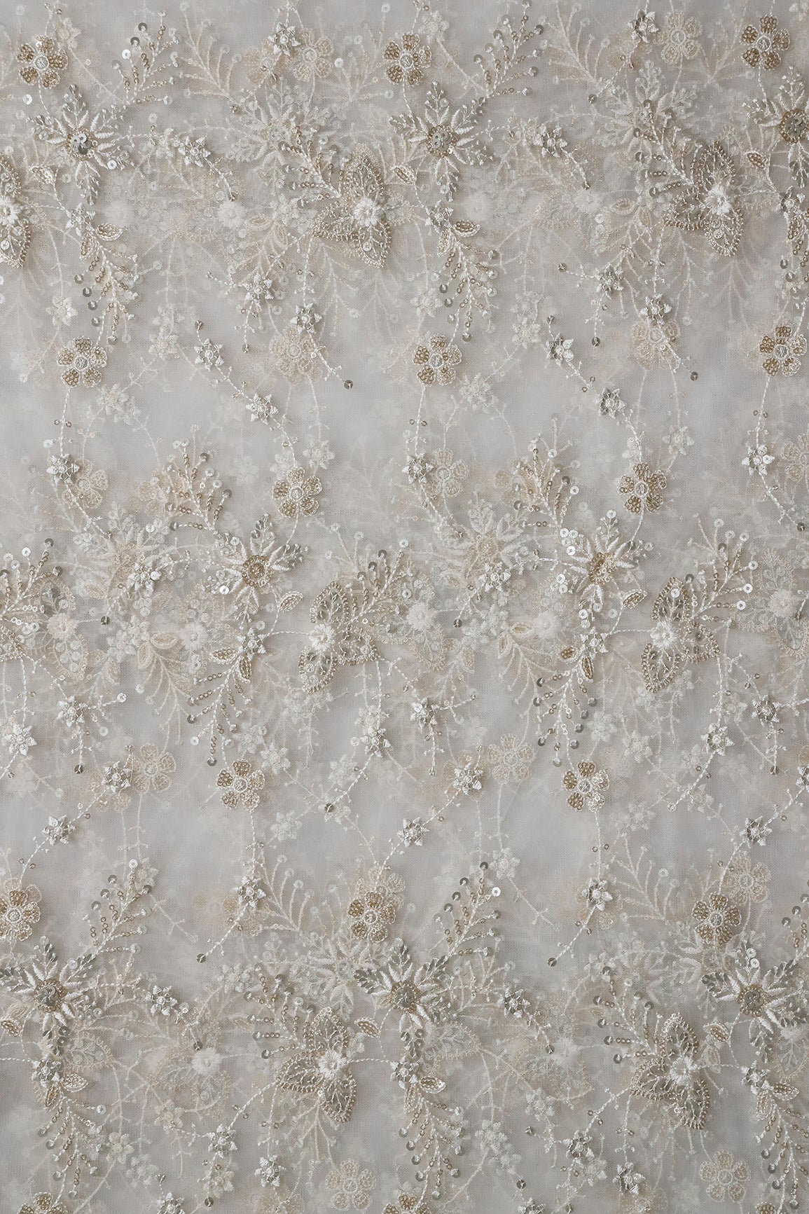 Beautiful White Thread With Sequins Floral Embroidery Work On White Dyeable Soft Net Fabric
