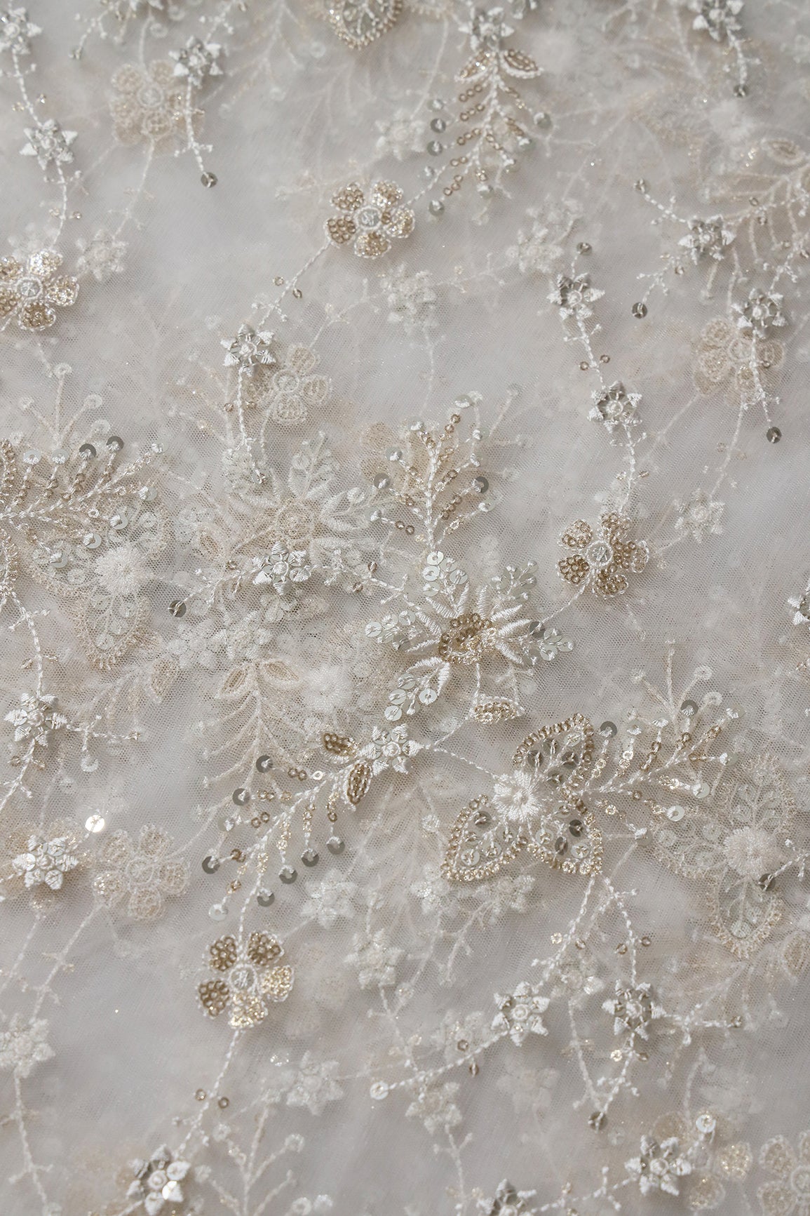 Beautiful White Thread With Sequins Floral Embroidery Work On White Dyeable Soft Net Fabric