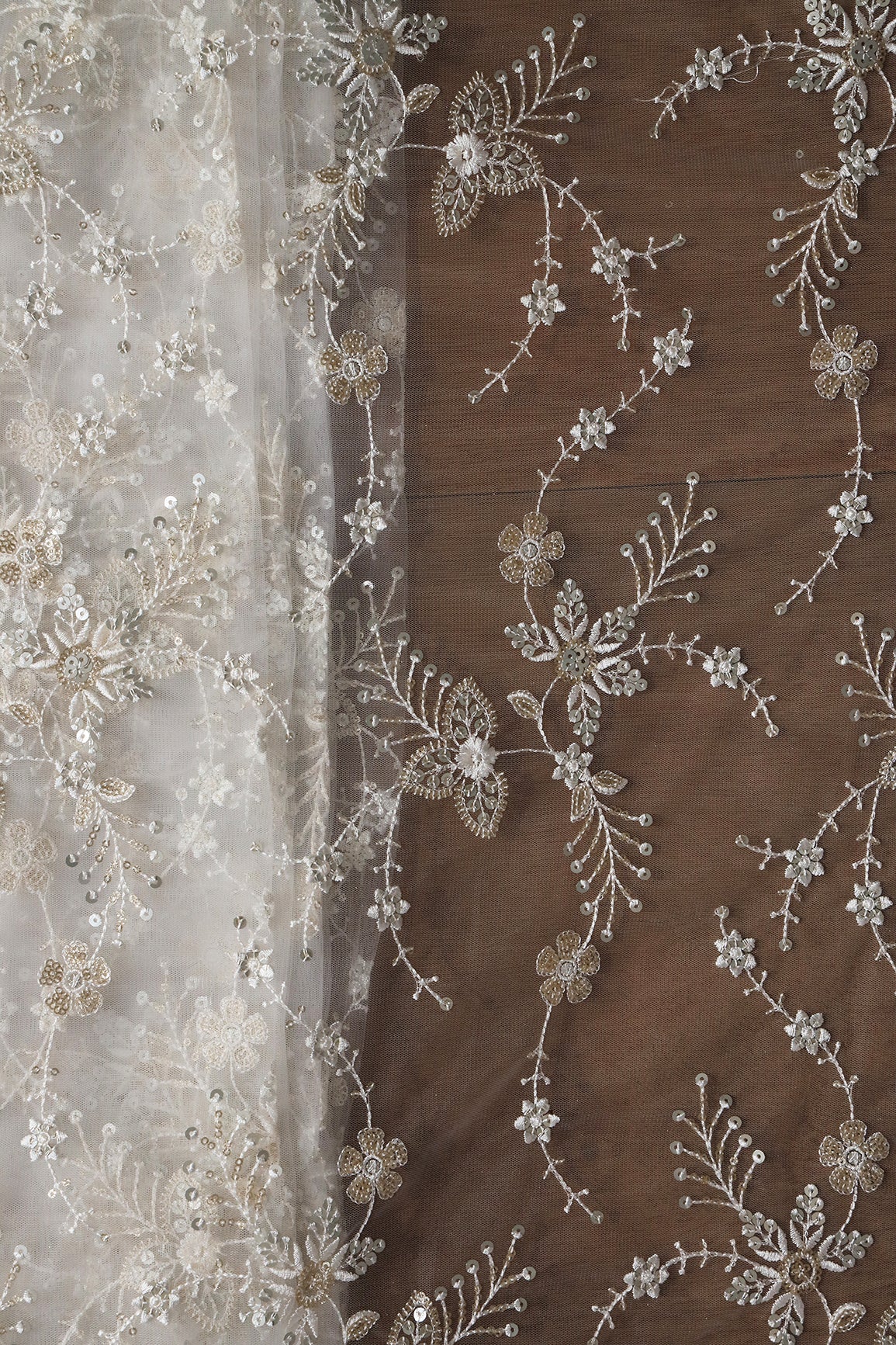 Beautiful White Thread With Sequins Floral Embroidery Work On White Dyeable Soft Net Fabric
