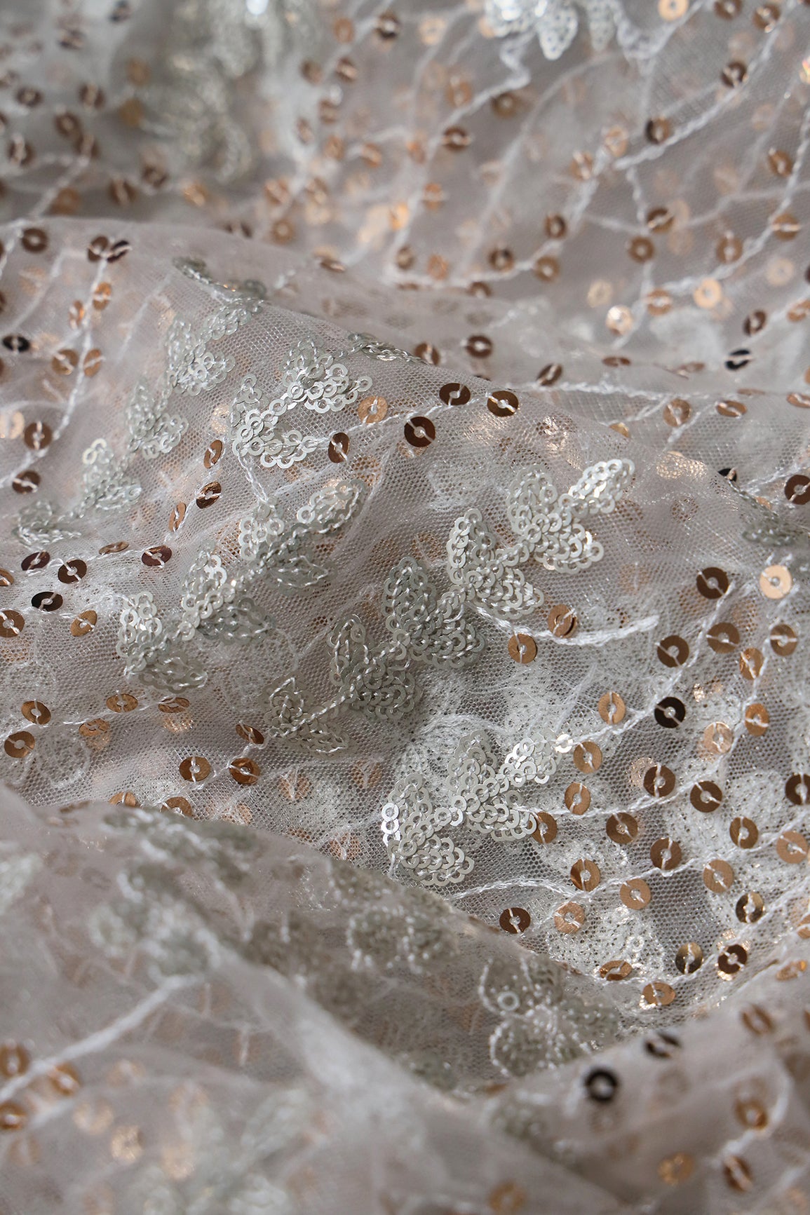 Gold And Silver Sequins Heavy Embroidery On Dyeable White Soft Net Fabric