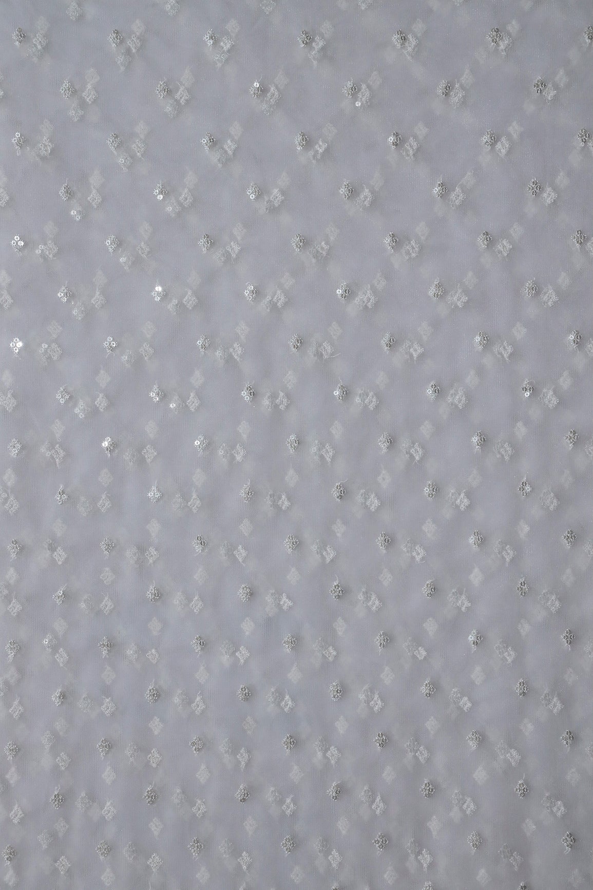 Small Motif Sequins Embroidery Work On White Dyeable Soft Net Fabric