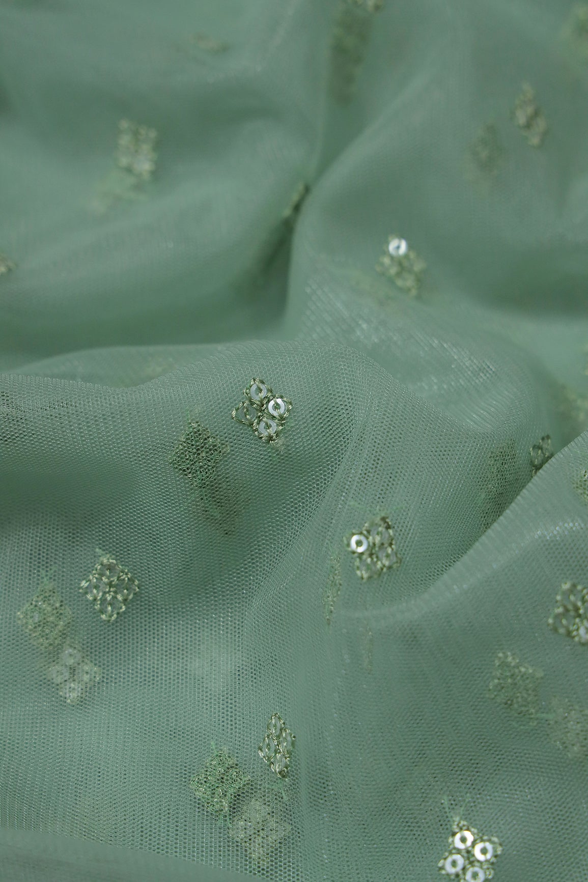 Small Motif Sequins Embroidery Work On Olive Soft Net Fabric