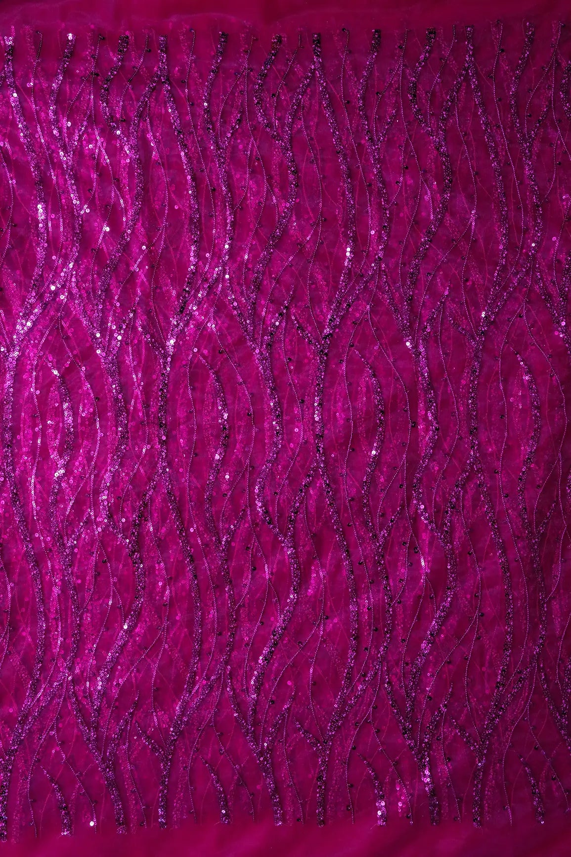 Beautiful Sequins With Fuchsia Thread Wavy Embroidery Work On Fuchsia Soft Net Fabric