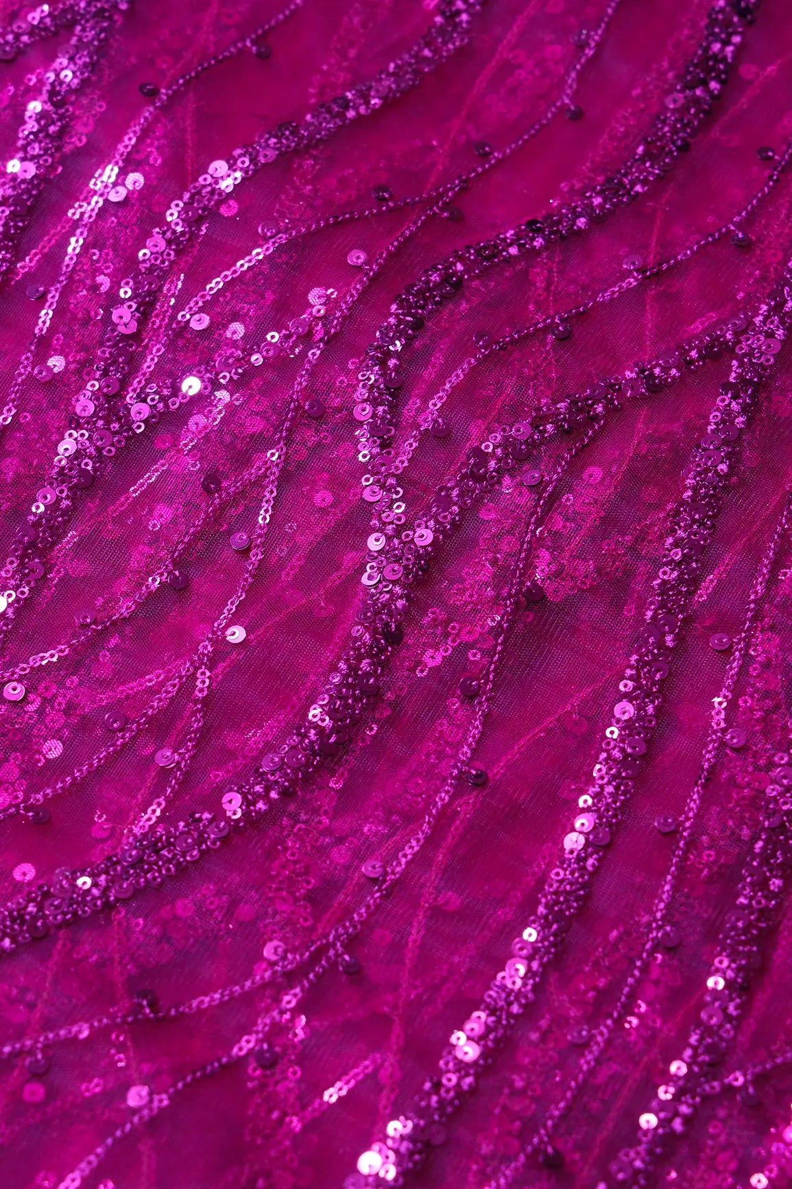 Beautiful Sequins With Fuchsia Thread Wavy Embroidery Work On Fuchsia Soft Net Fabric
