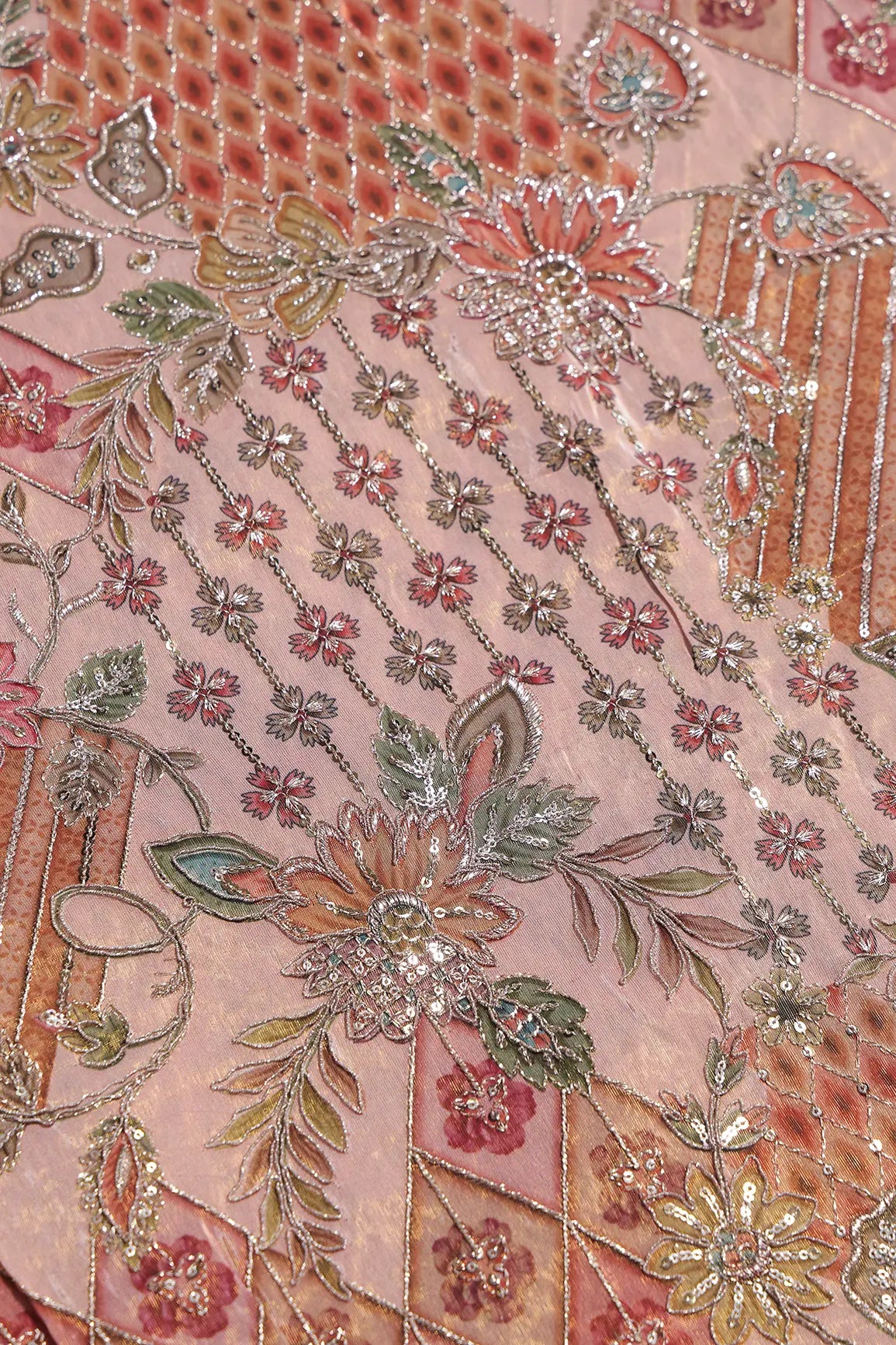 Floral Positional Print On Sequins With Zari Embroidery Work On Peach Viscose Zari Tissue Fabric