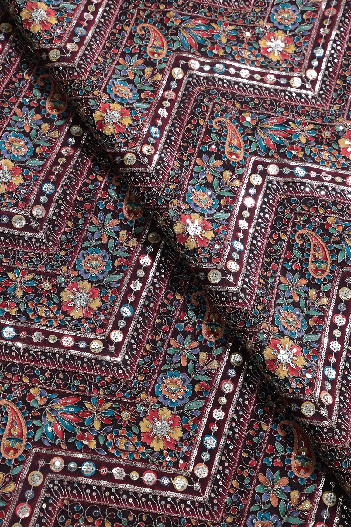 Zari & Sequins With Multi Color Chevron Print Heavy Embroidery Work On Maroon Pure Crepe Fabric