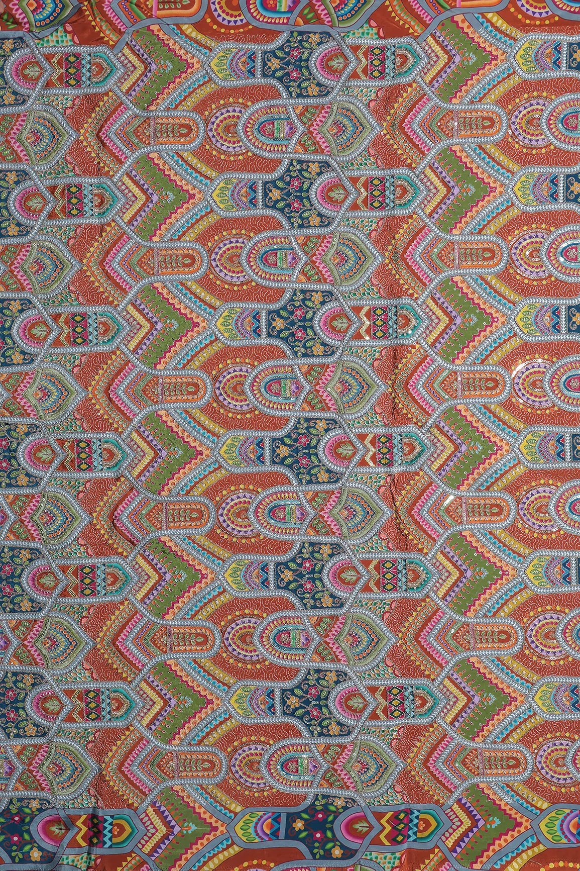 Zari & Sequins With Multi Color Geometric Print Heavy Embroidery Work On Rust Pure Crepe Fabric