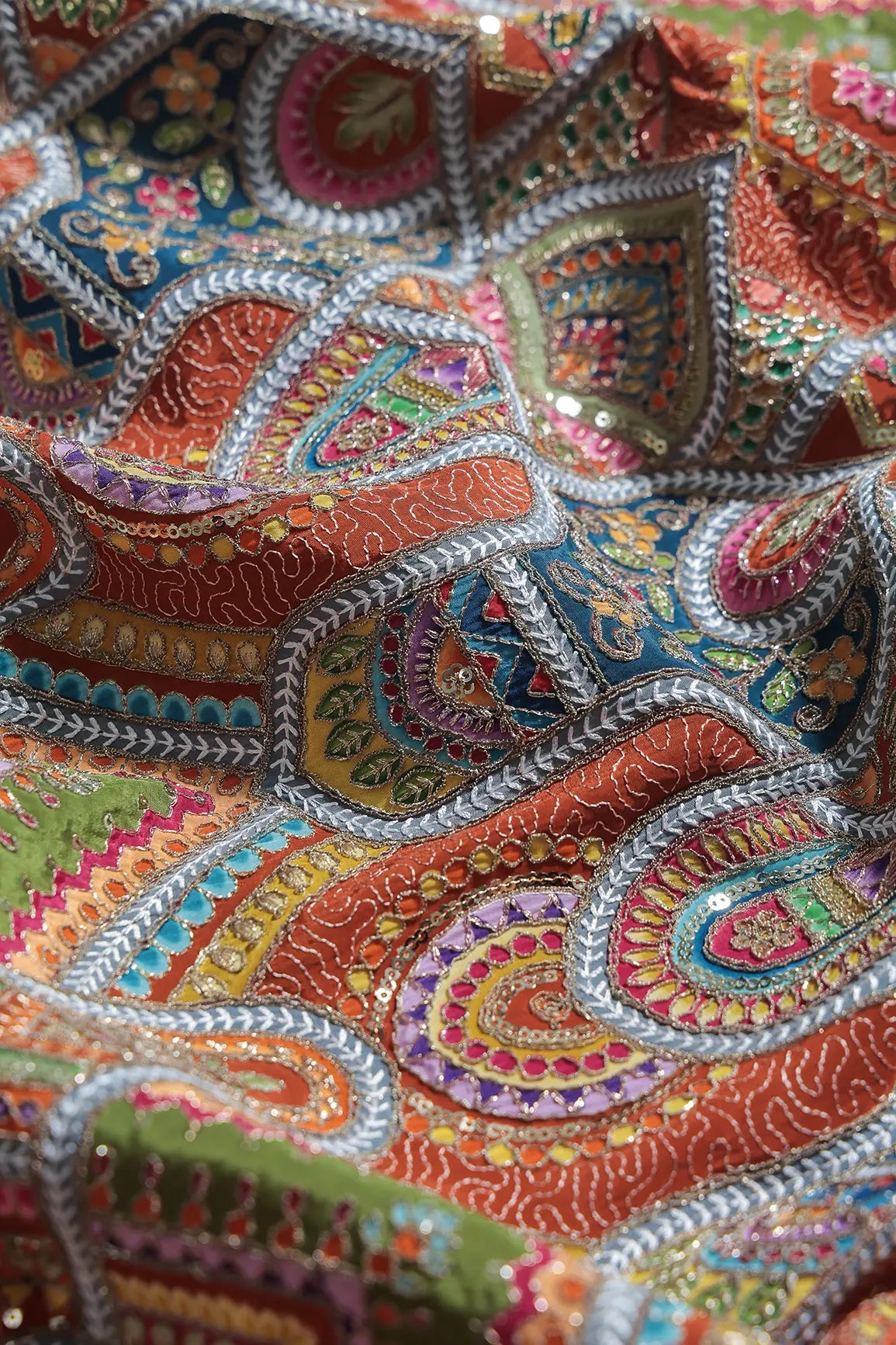 Zari & Sequins With Multi Color Geometric Print Heavy Embroidery Work On Rust Pure Crepe Fabric