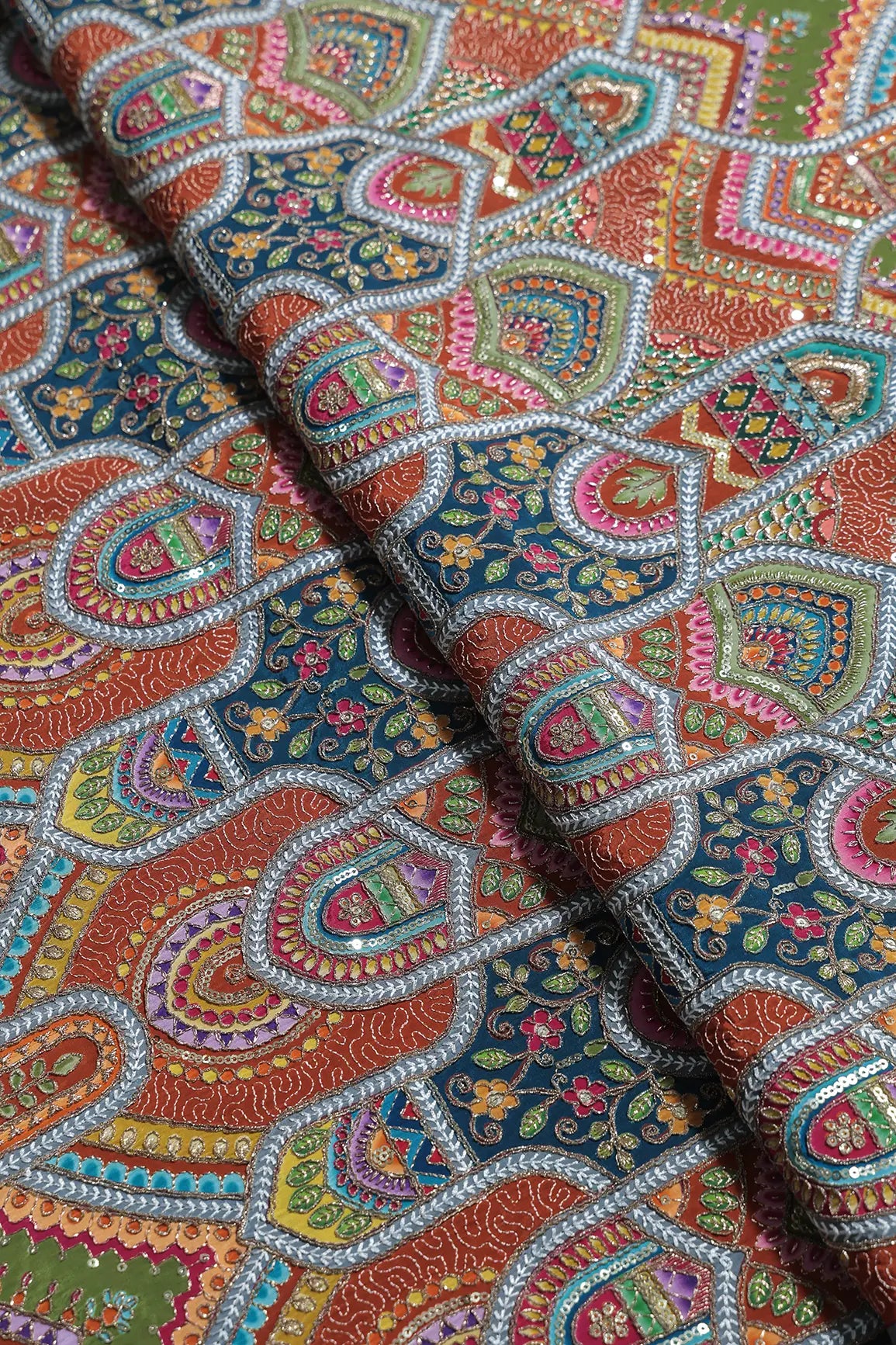 Zari & Sequins With Multi Color Geometric Print Heavy Embroidery Work On Rust Pure Crepe Fabric