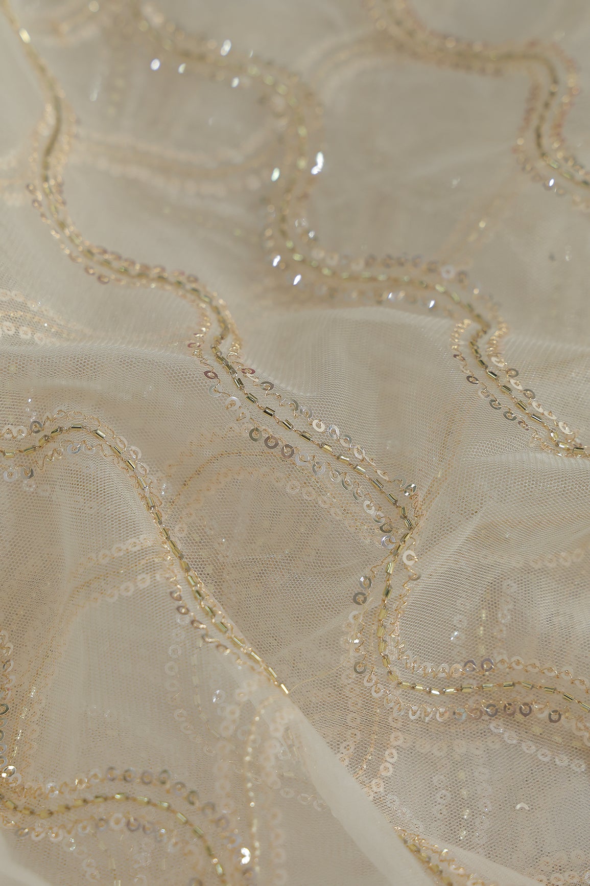 Leheriya Embroidery Work With Sequins And Beads On Cream Soft Net Fabric