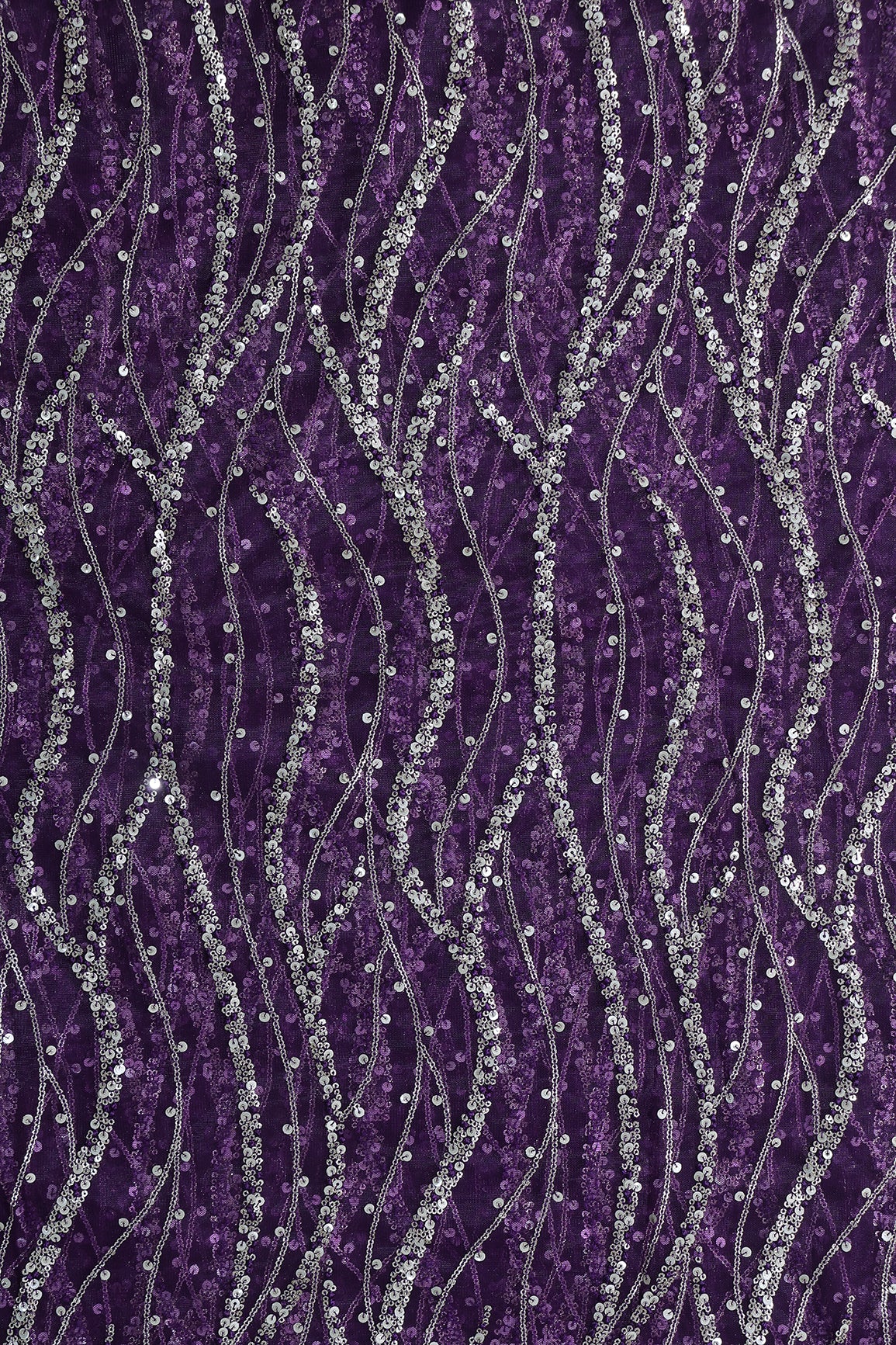 Gold And Silver Sequins With Purple Thread Wavy Embroidery Work On Purple Soft Net Fabric