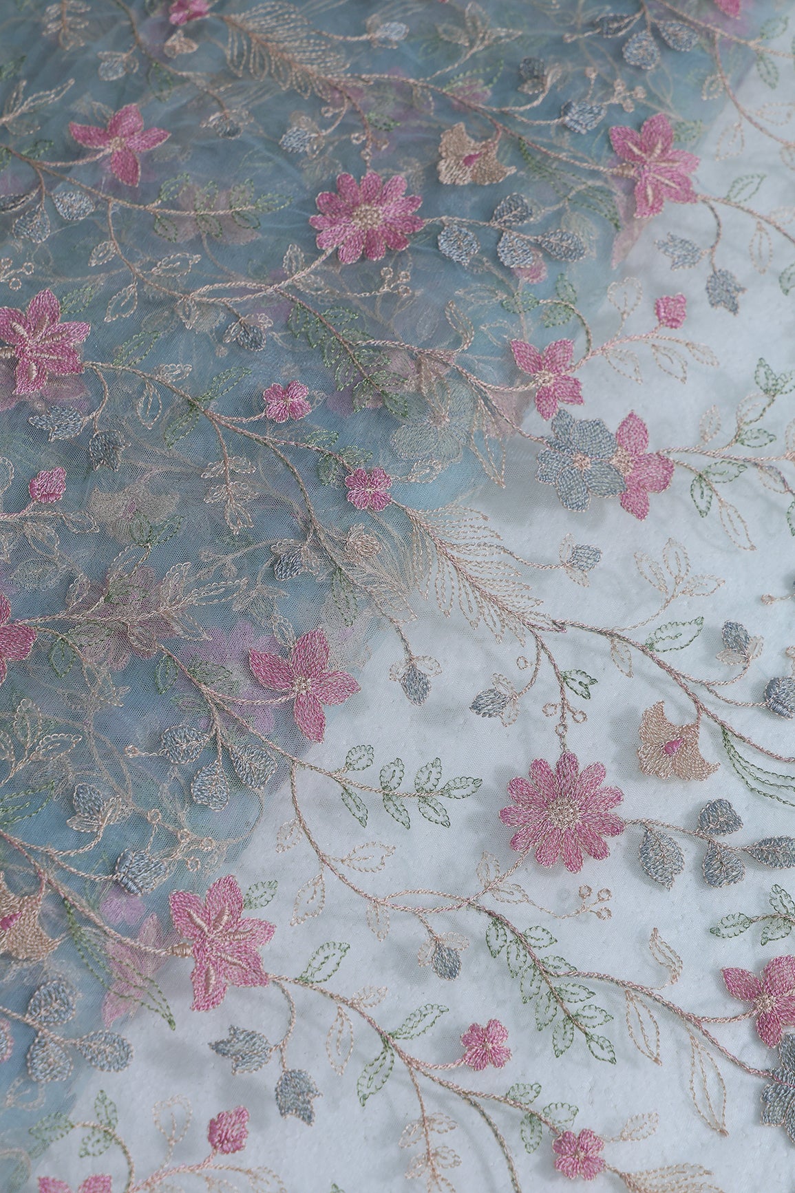 Multi Colour Floral Thread Embroidery Work On Sky Blue Soft Net Fabric