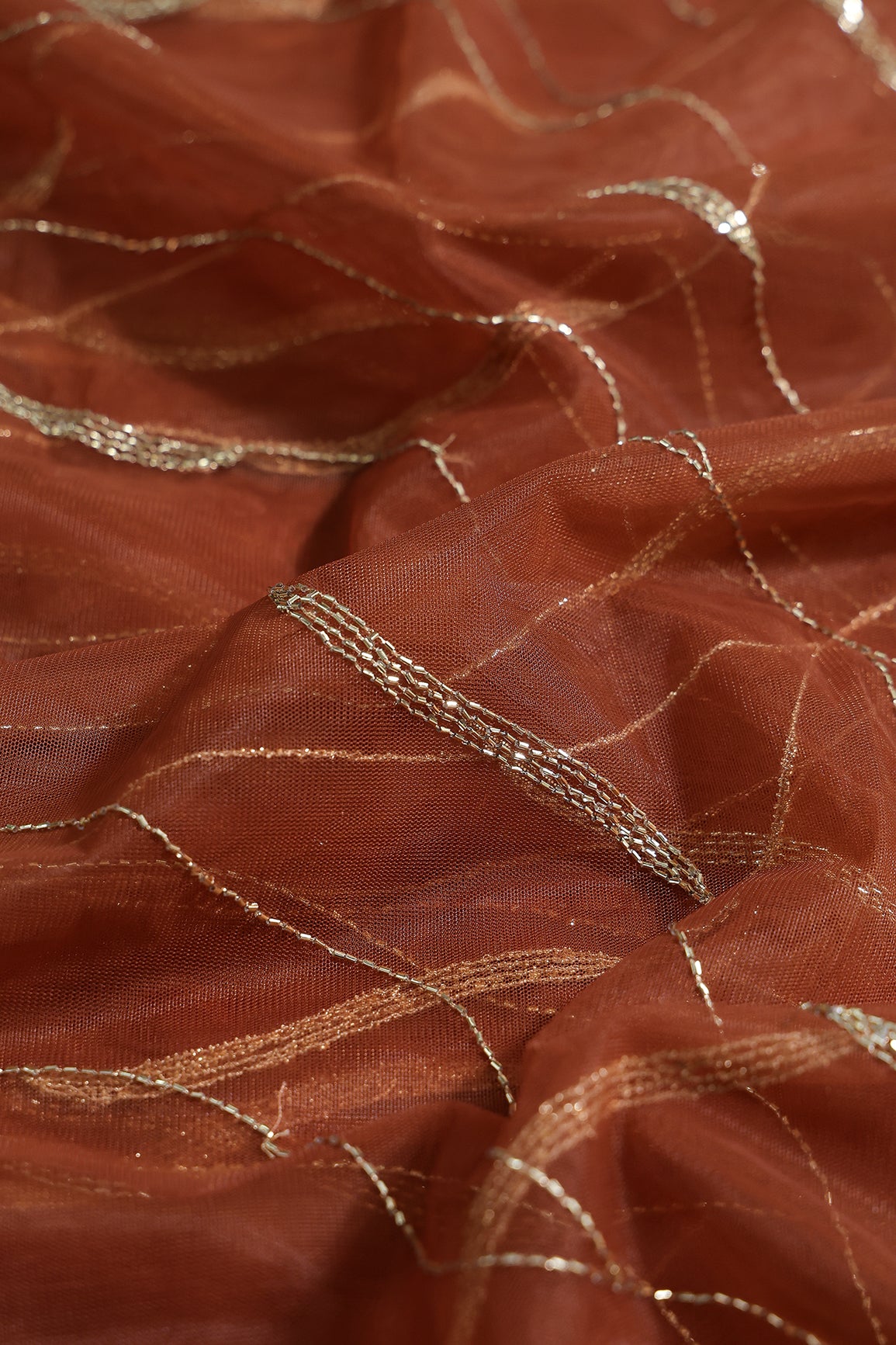 Leheriya Embroidery Work With Sequins And Beads On Rust Soft Net Fabric