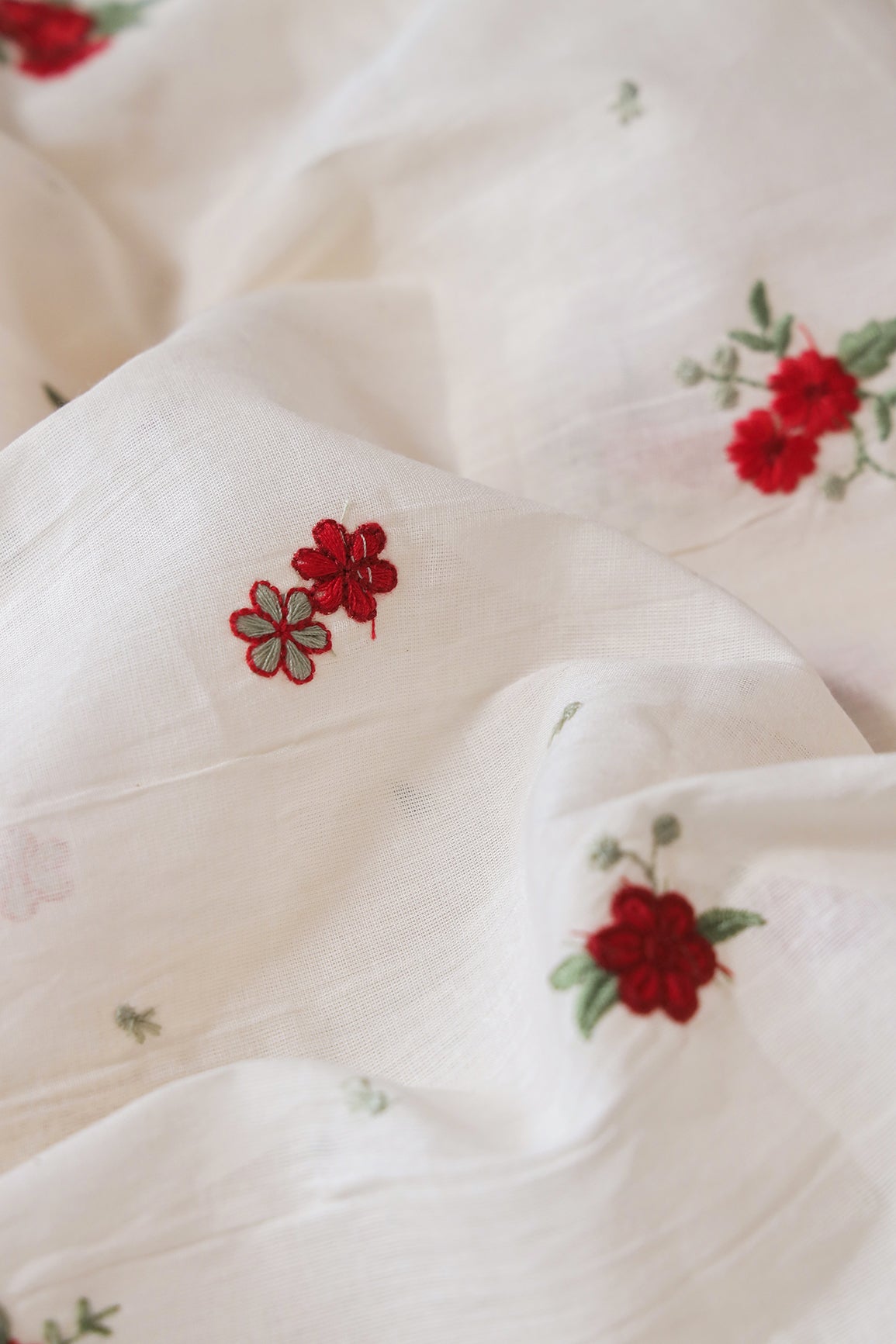 Red And Olive Thread Small Floral Embroidery On Off White Organic Cotton Fabric