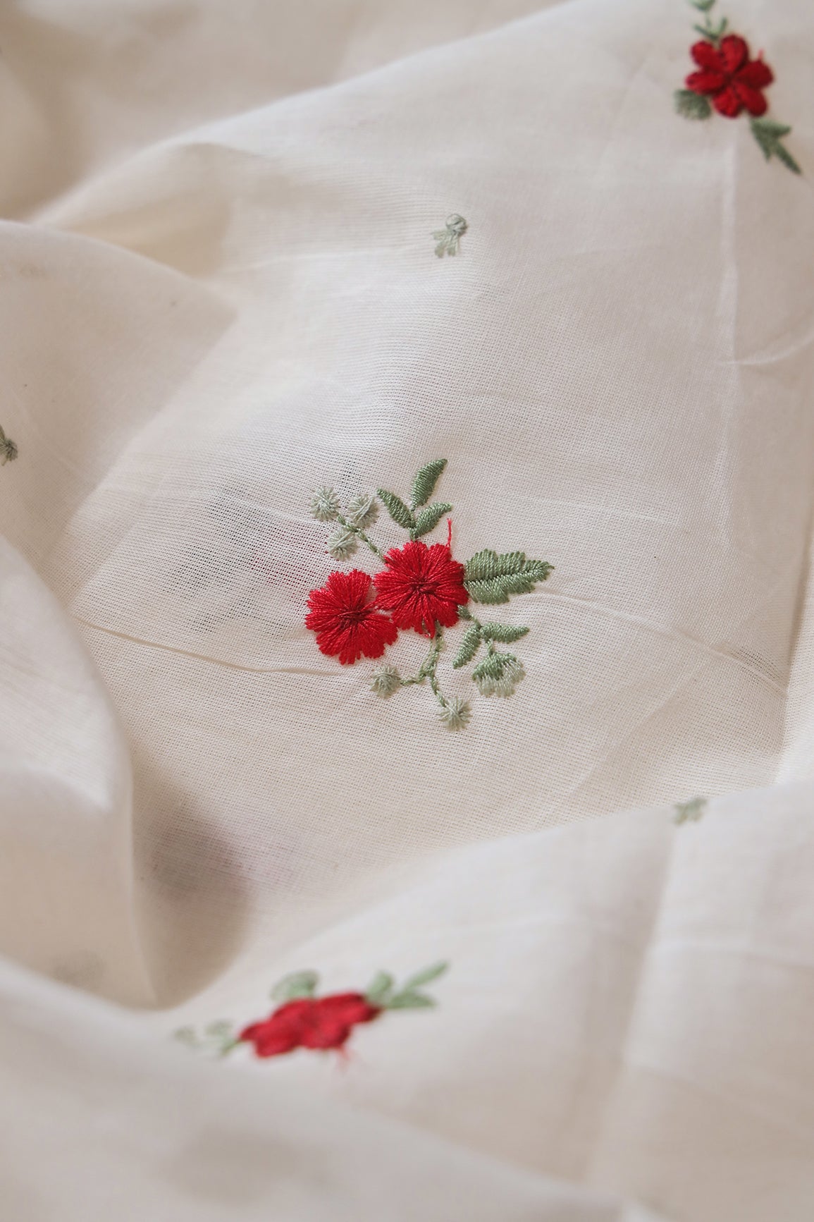 Red And Olive Thread Small Floral Embroidery On Off White Organic Cotton Fabric