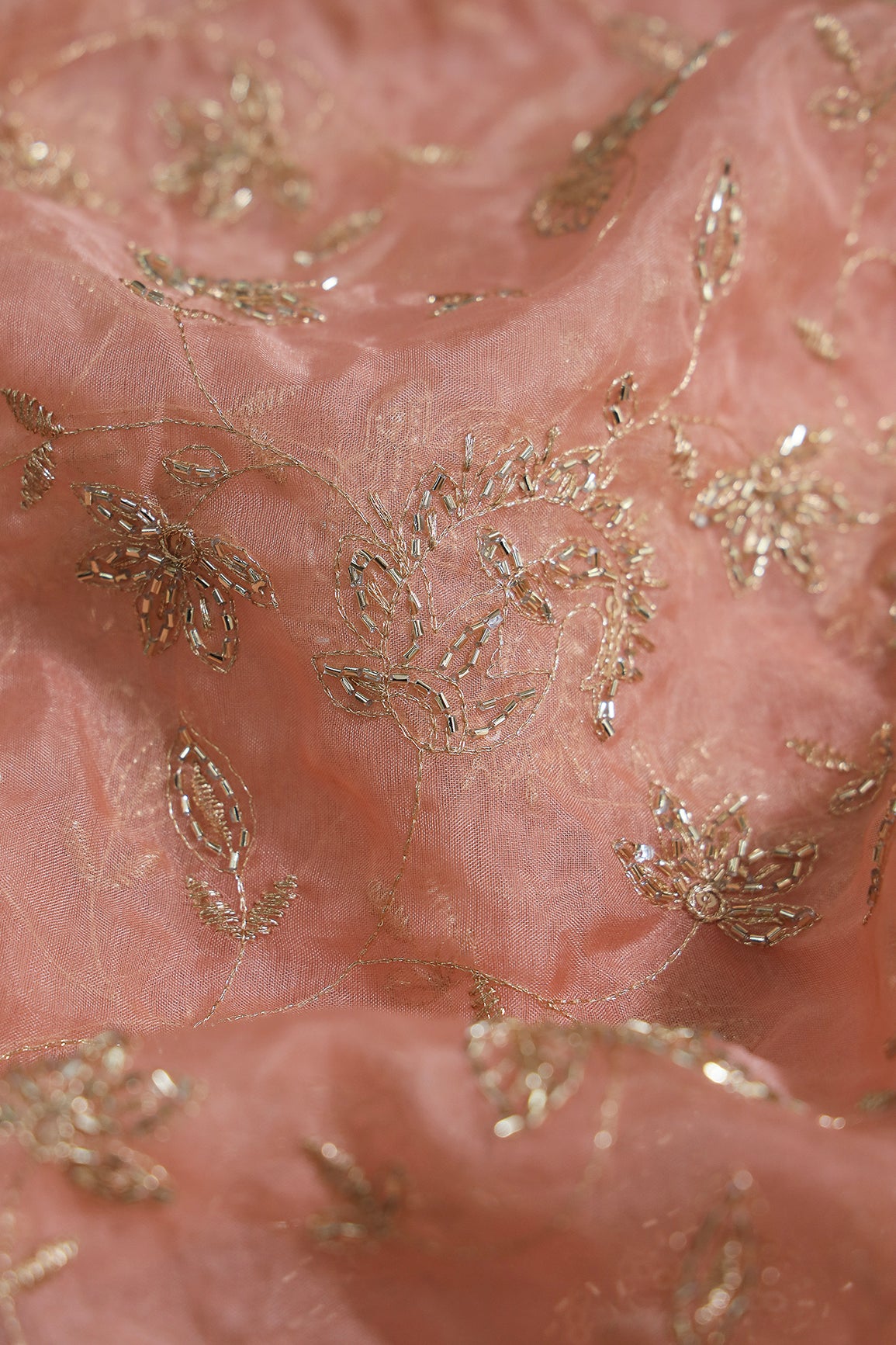 Gold Sequins & Beads With Zari Floral Leafy Paisley Embroidery Work On Peach Organza Fabric