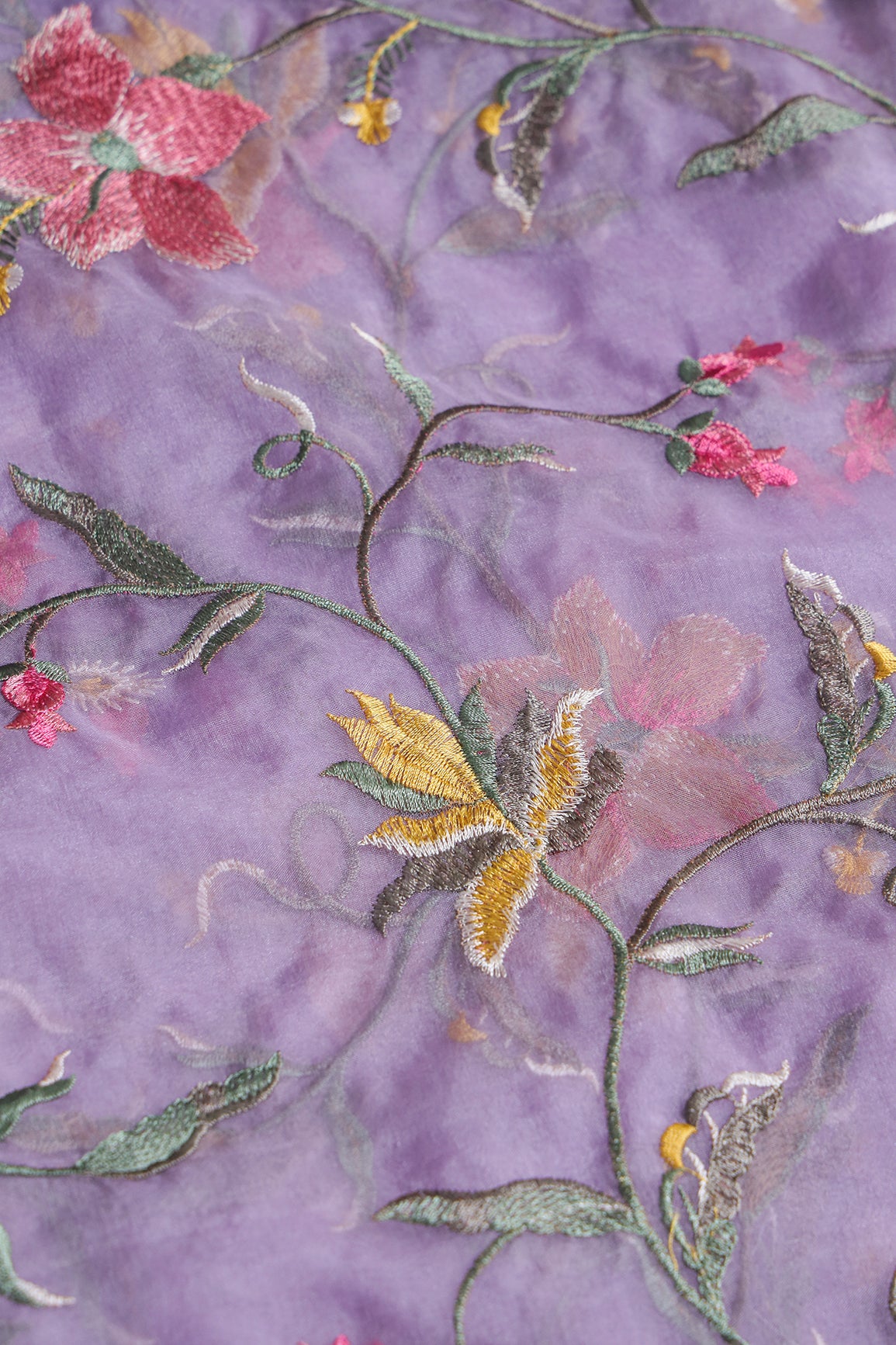 Elegant Floral Multi Color Thread Embroidery Work On Lavender Organza Fabric