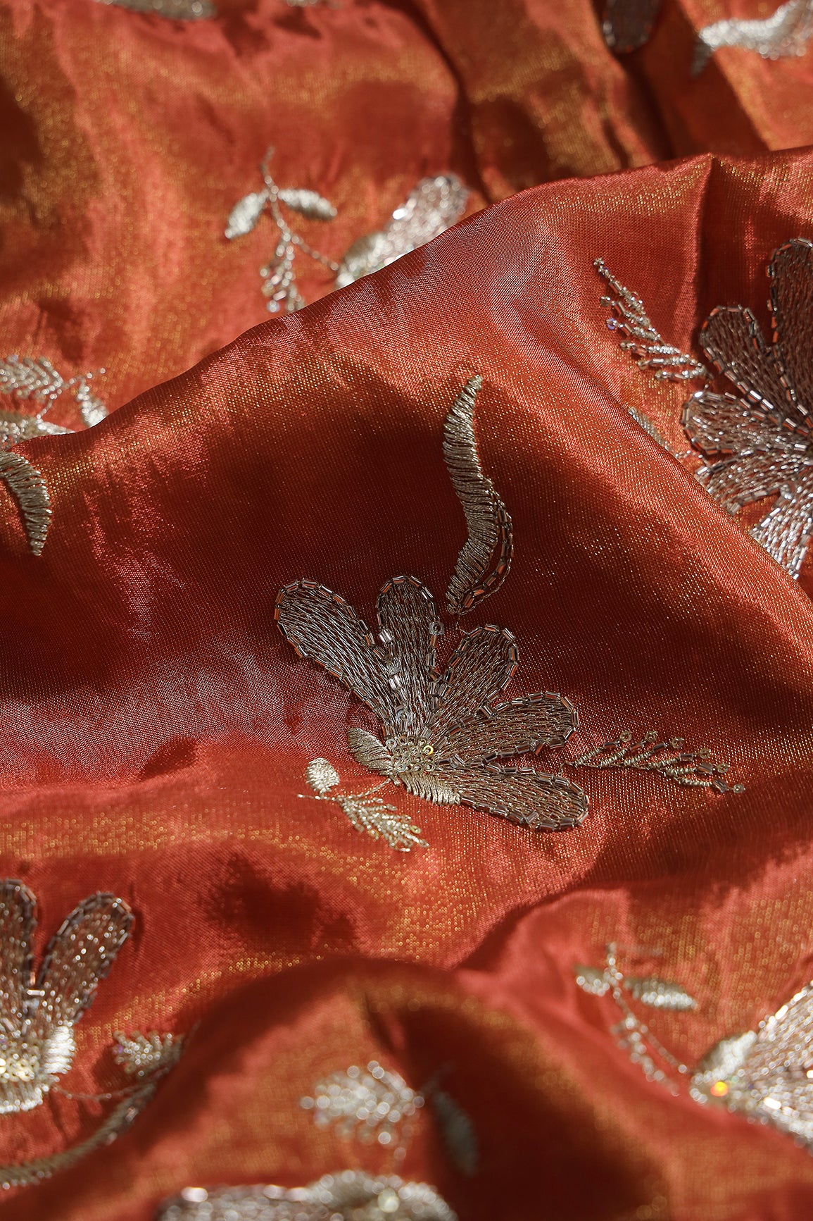 Multi Sequins & Beads With Zari Floral Embroidery Work On Rust Shiny Viscose Zari Tissue Fabric