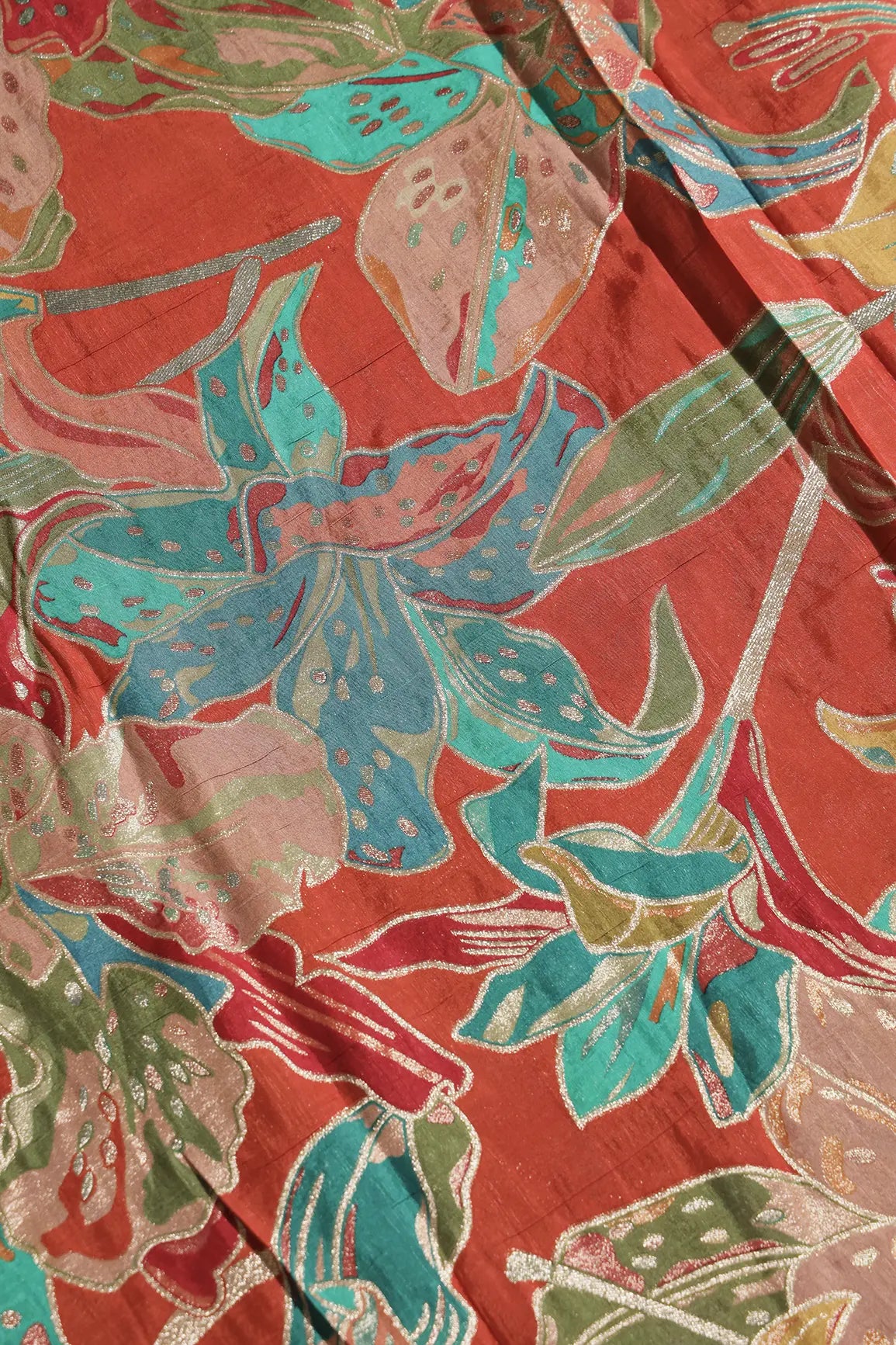Positional Floral Zari Print On Rust Orange Viscose Dola Silk Jacquard Fabric