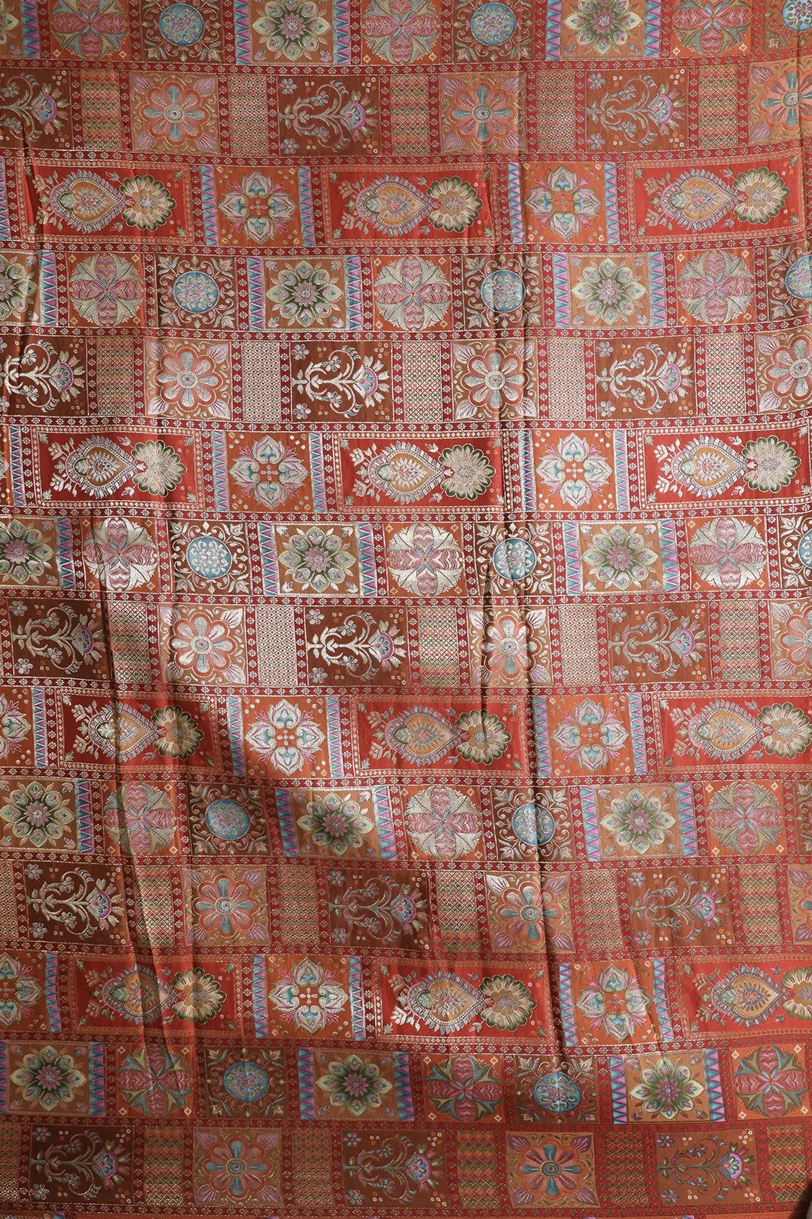 Positional Floral Zari Print On Orange Viscose Dola Silk Jacquard Fabric