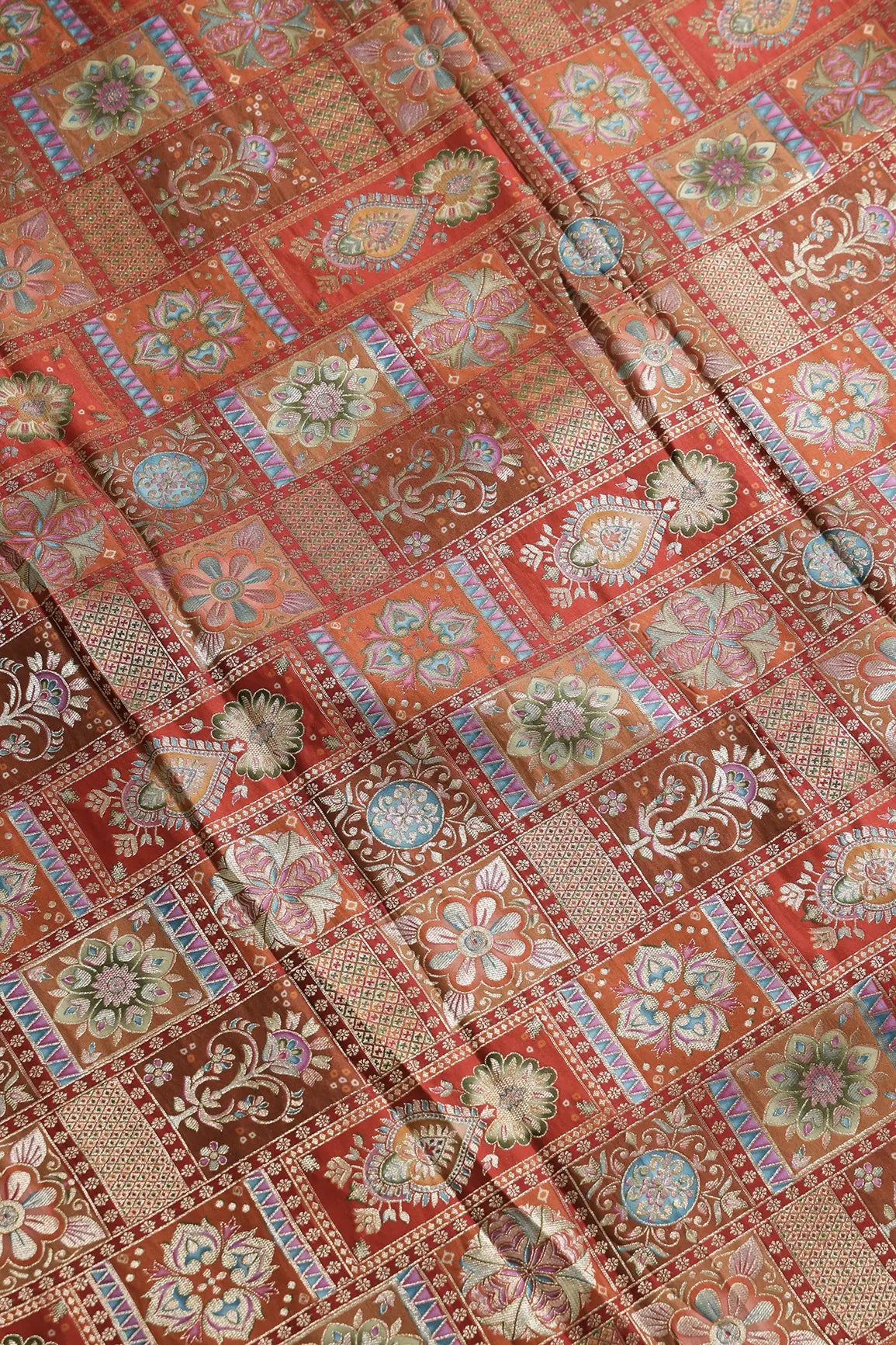 Positional Floral Zari Print On Orange Viscose Dola Silk Jacquard Fabric