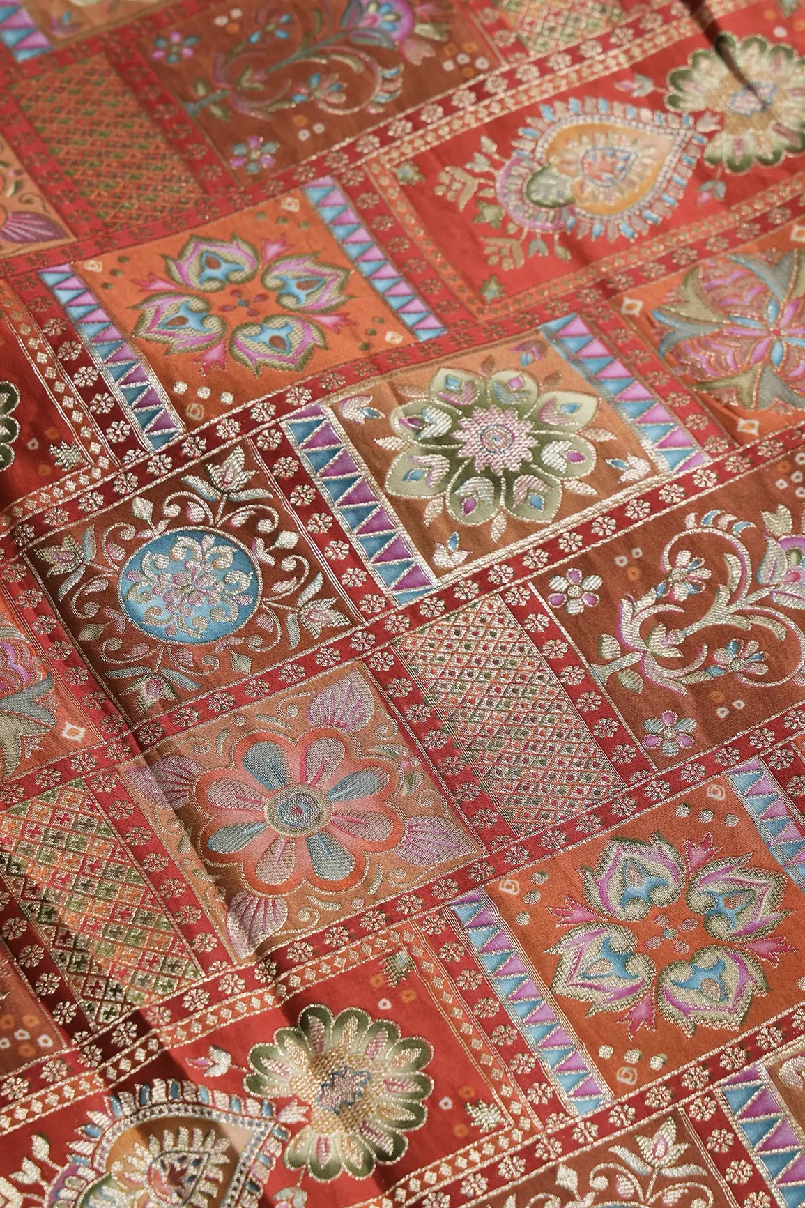 Positional Floral Zari Print On Orange Viscose Dola Silk Jacquard Fabric