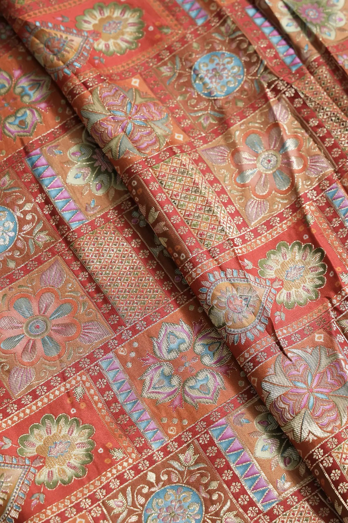Positional Floral Zari Print On Orange Viscose Dola Silk Jacquard Fabric