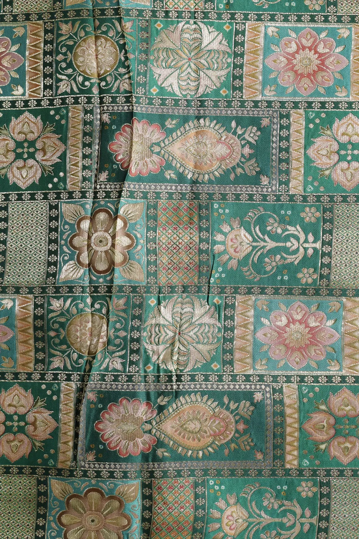 Positional Floral Zari Print On Green Viscose Dola Silk Jacquard Fabric
