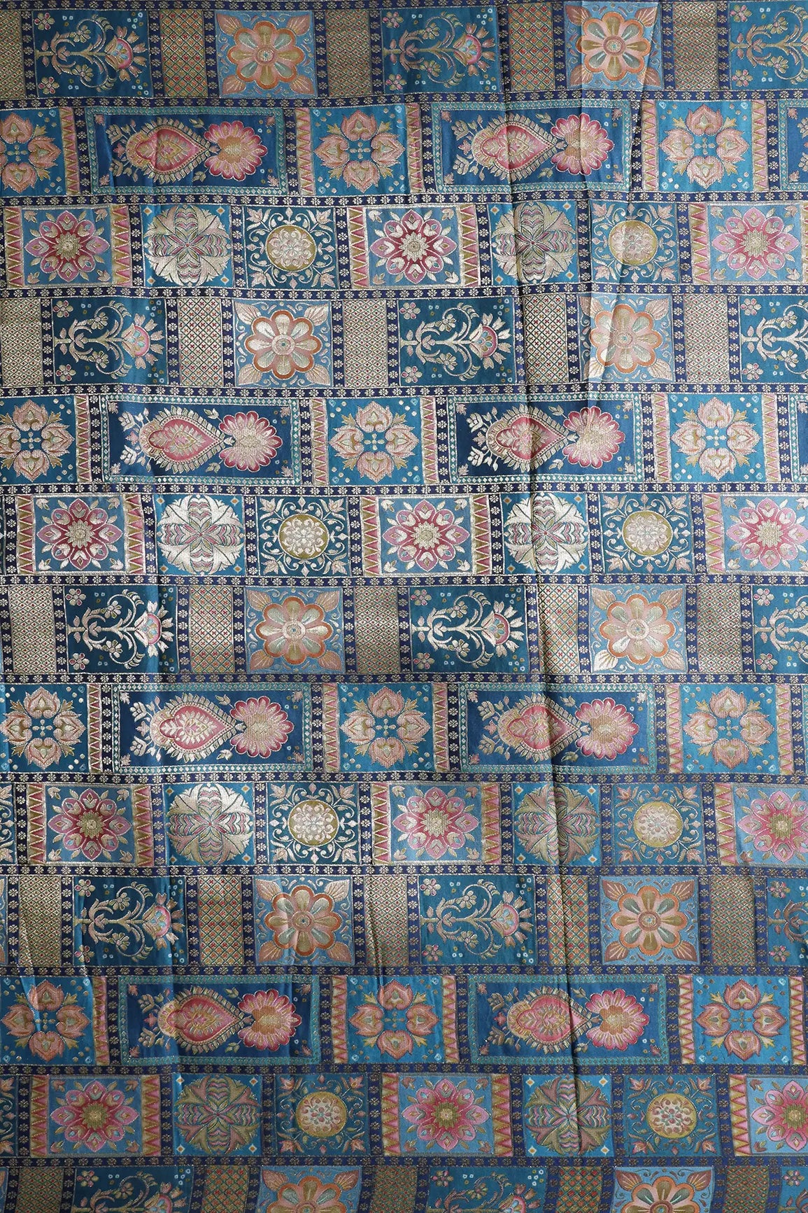 Positional Floral Zari Print On Rama Blue Viscose Dola Silk Jacquard Fabric