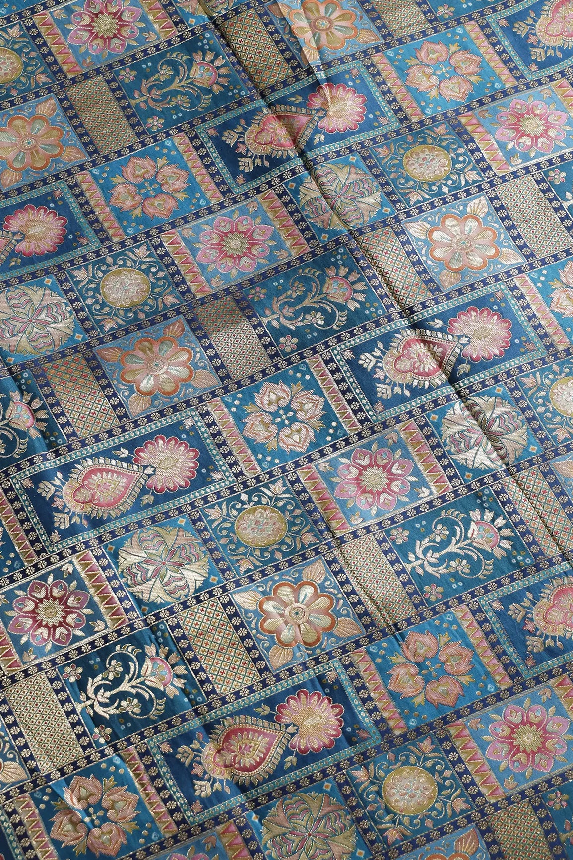 Positional Floral Zari Print On Rama Blue Viscose Dola Silk Jacquard Fabric