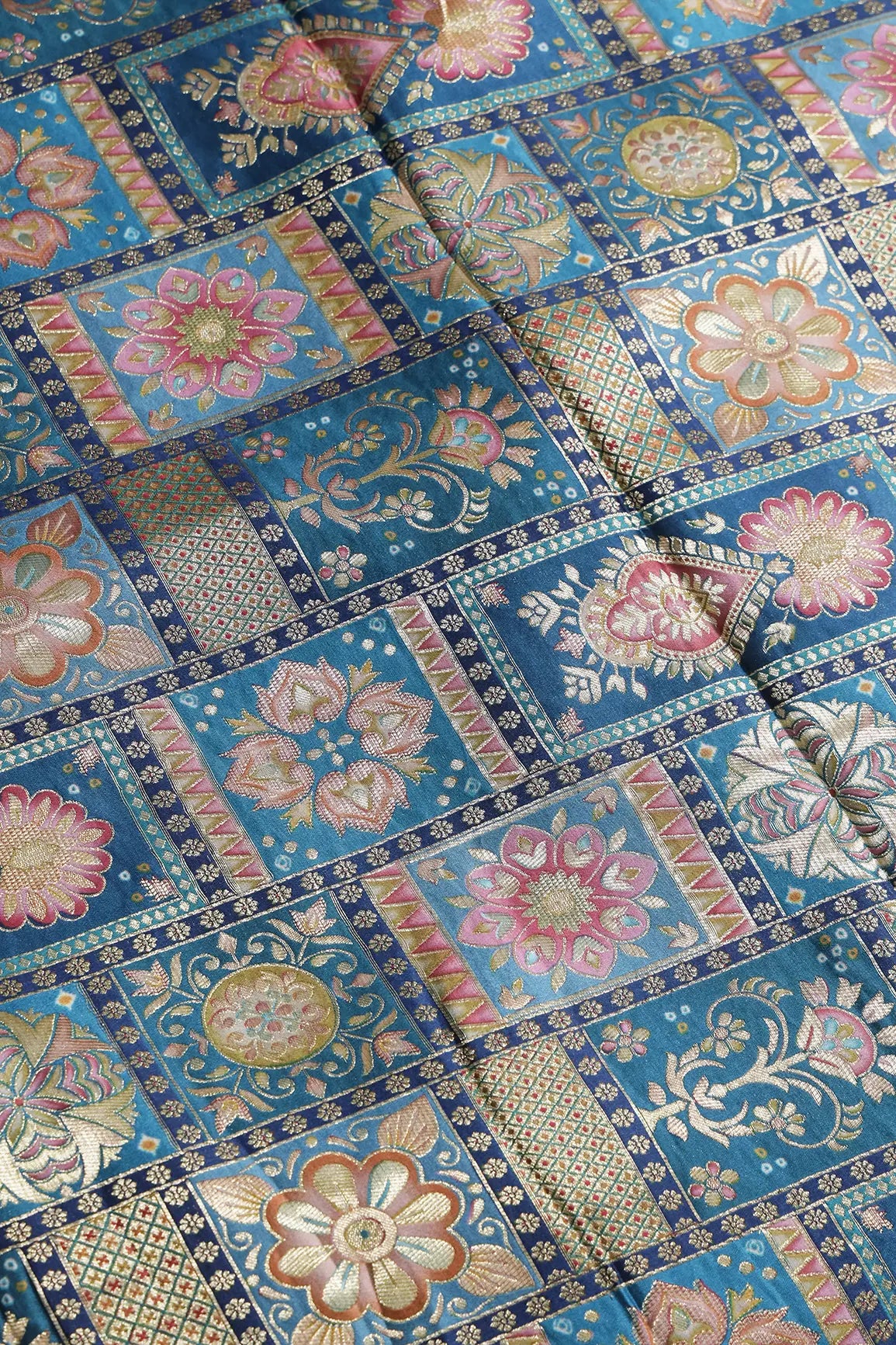 Positional Floral Zari Print On Rama Blue Viscose Dola Silk Jacquard Fabric