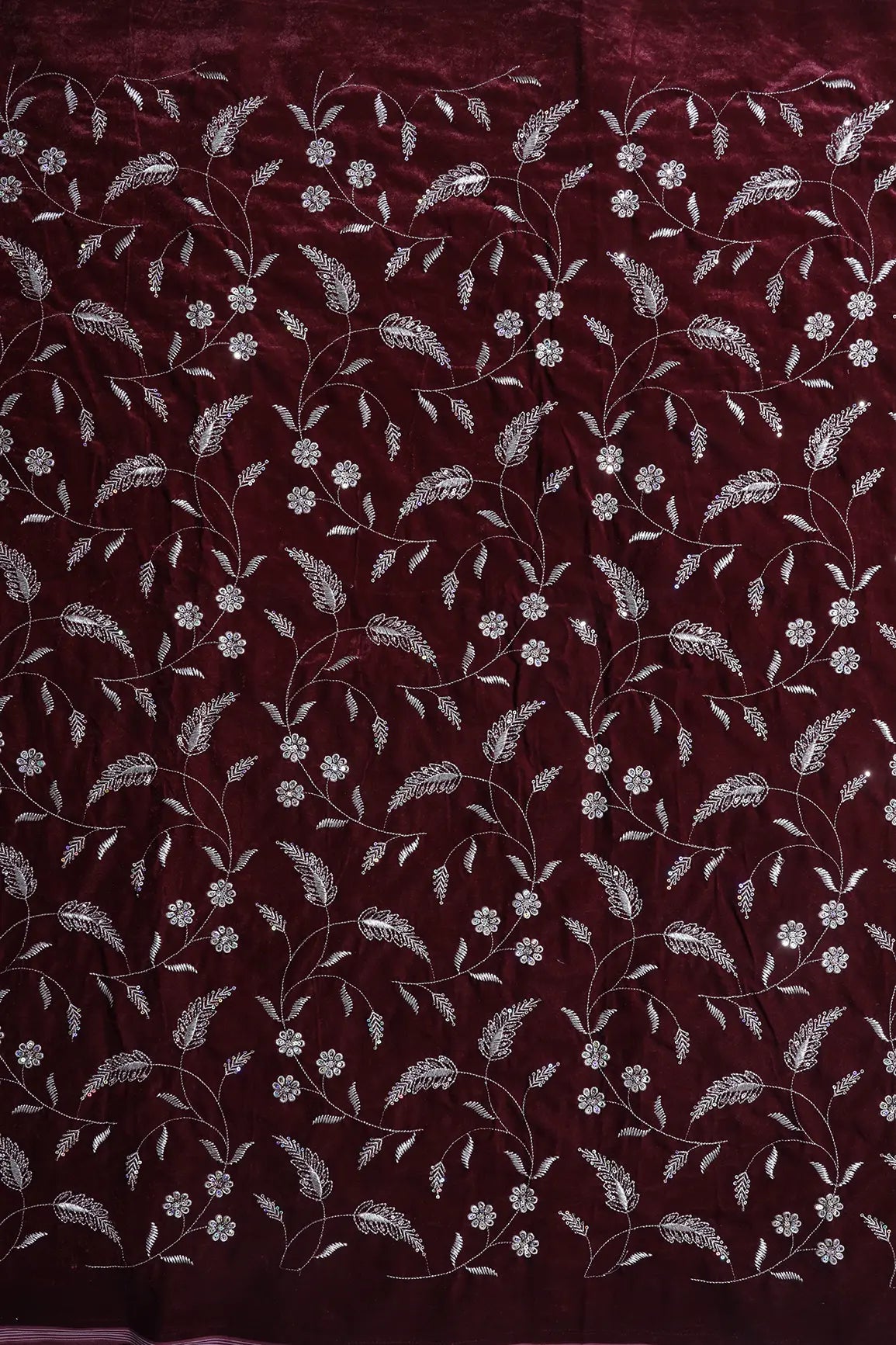 Gold Sequins With Gold Zari Floral Leafy Embroidery Work On Maroon Velvet Fabric