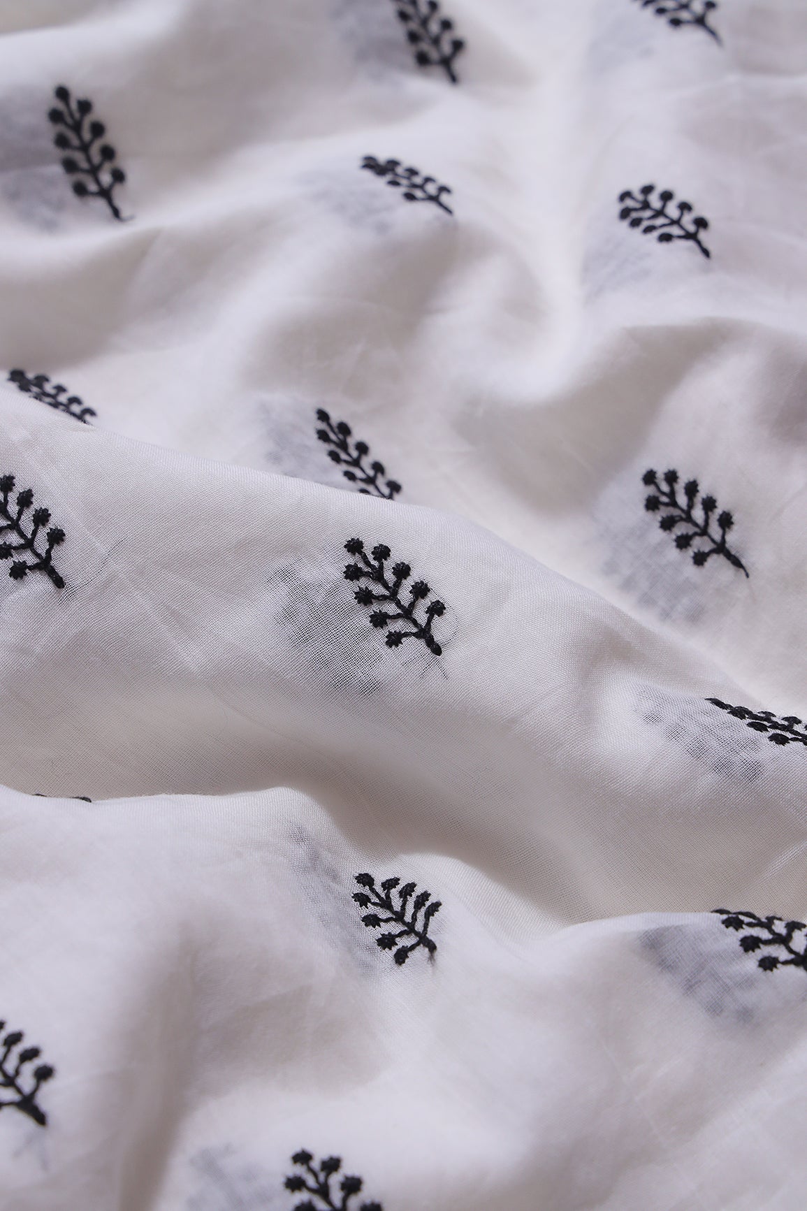 Black Thread Leafy Embroidery On White Pure Mul Cotton Fabric