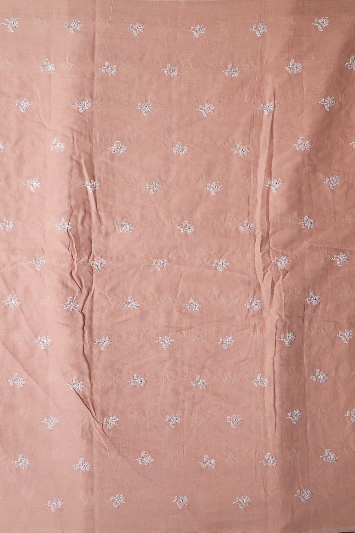 White Thread Small Floral Embroidery On Peach Pure Mul Cotton Fabric